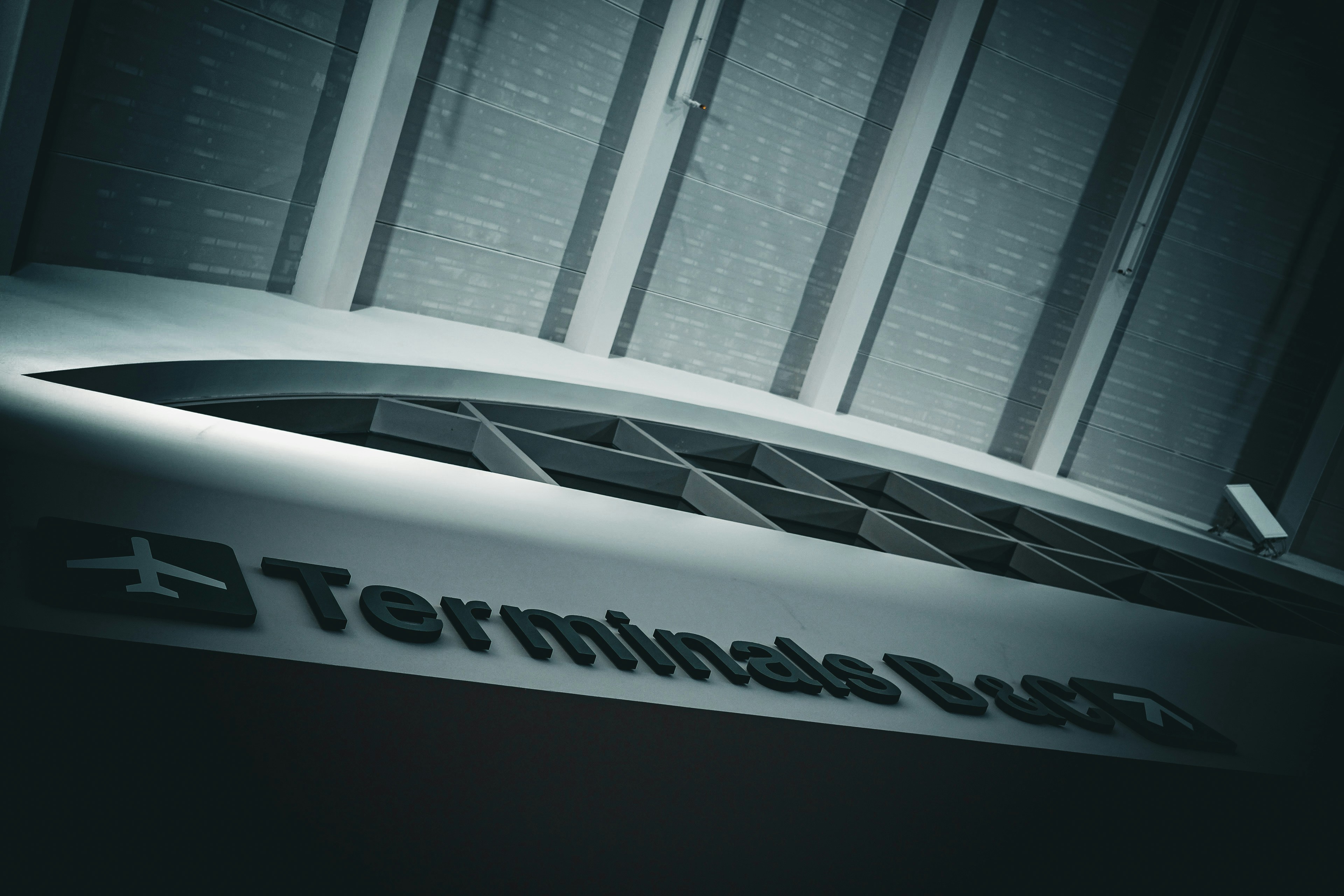 Modern airport terminal building with signage