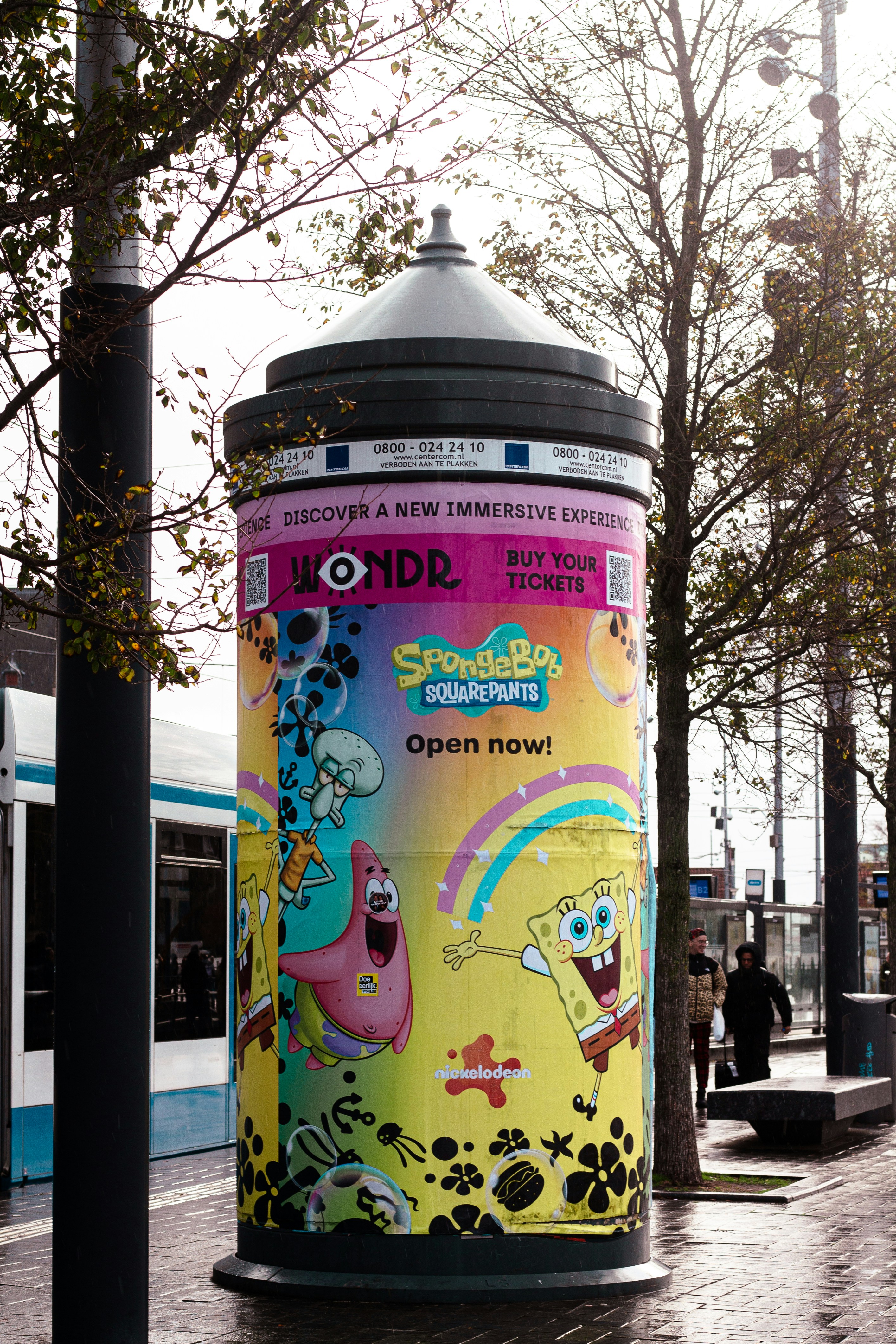 Spongebob squarepants advertisement on a cylindrical structure.