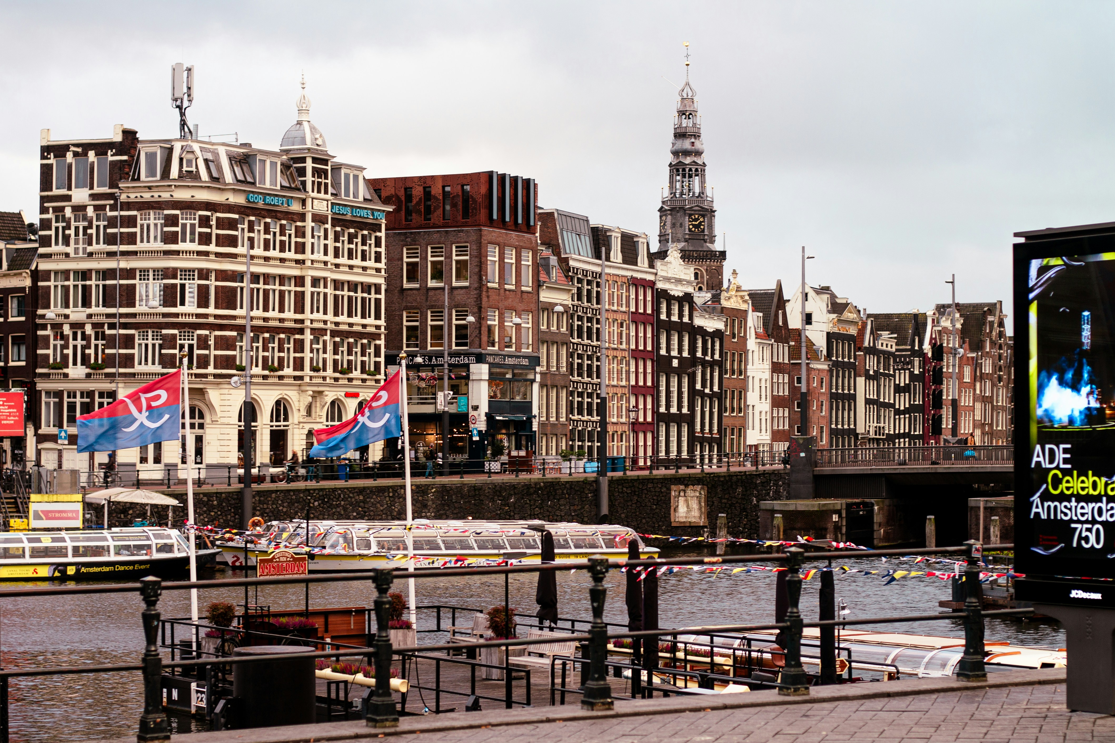 Canal with boats and buildings in amsterdam