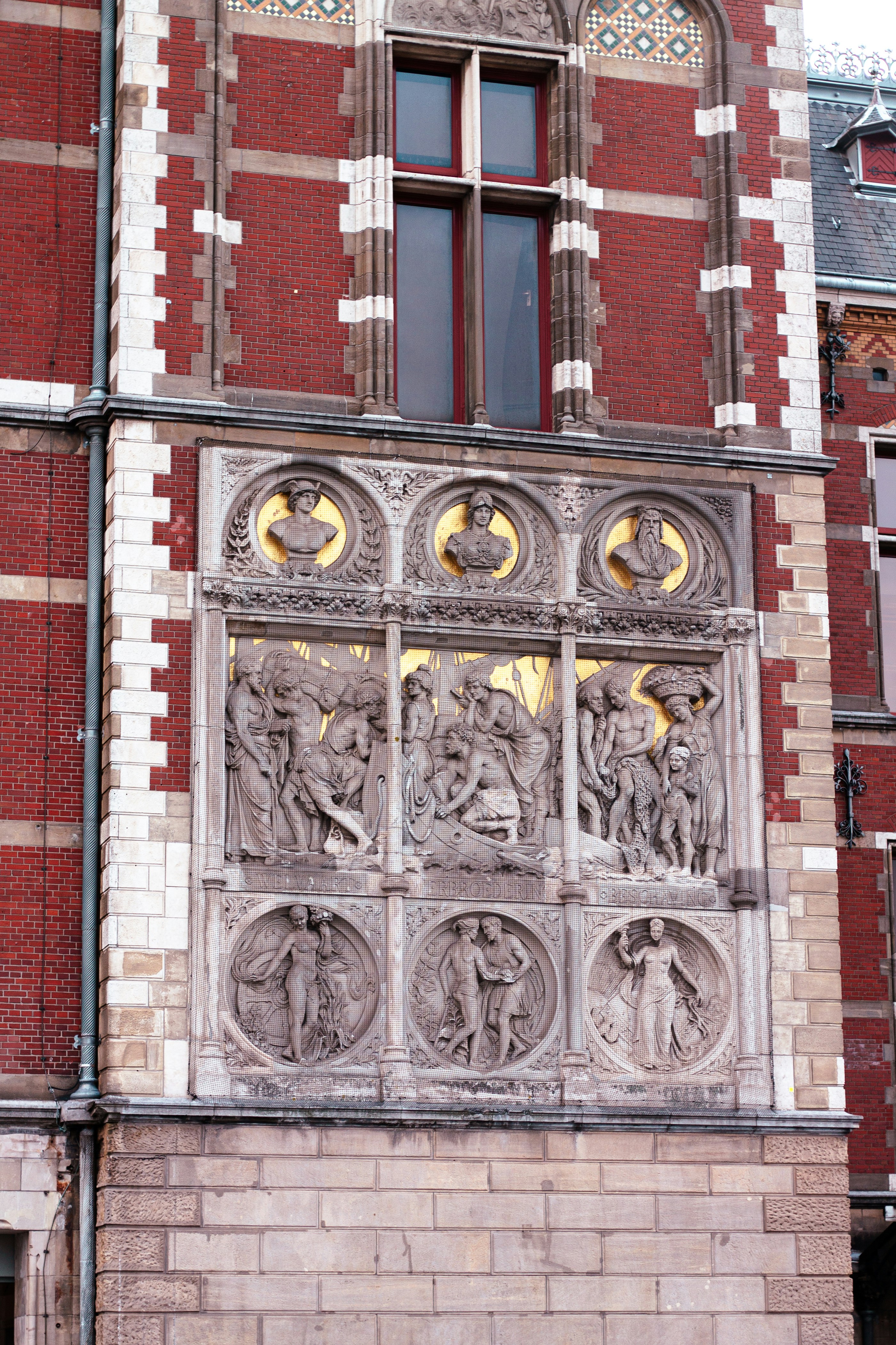 Ornate architectural relief with busts and figures