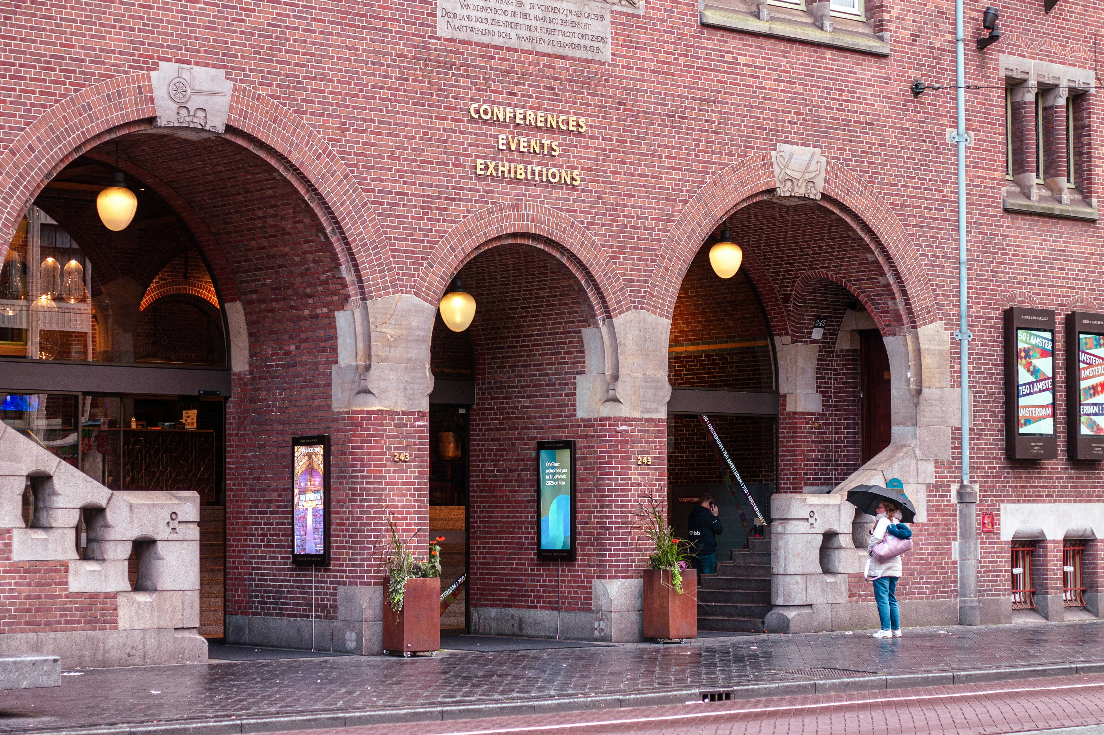 Brick building with arched entrances and signage