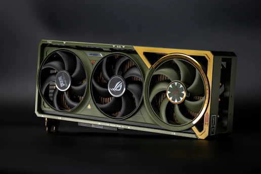 Three-fan graphics card with olive and gold accents.