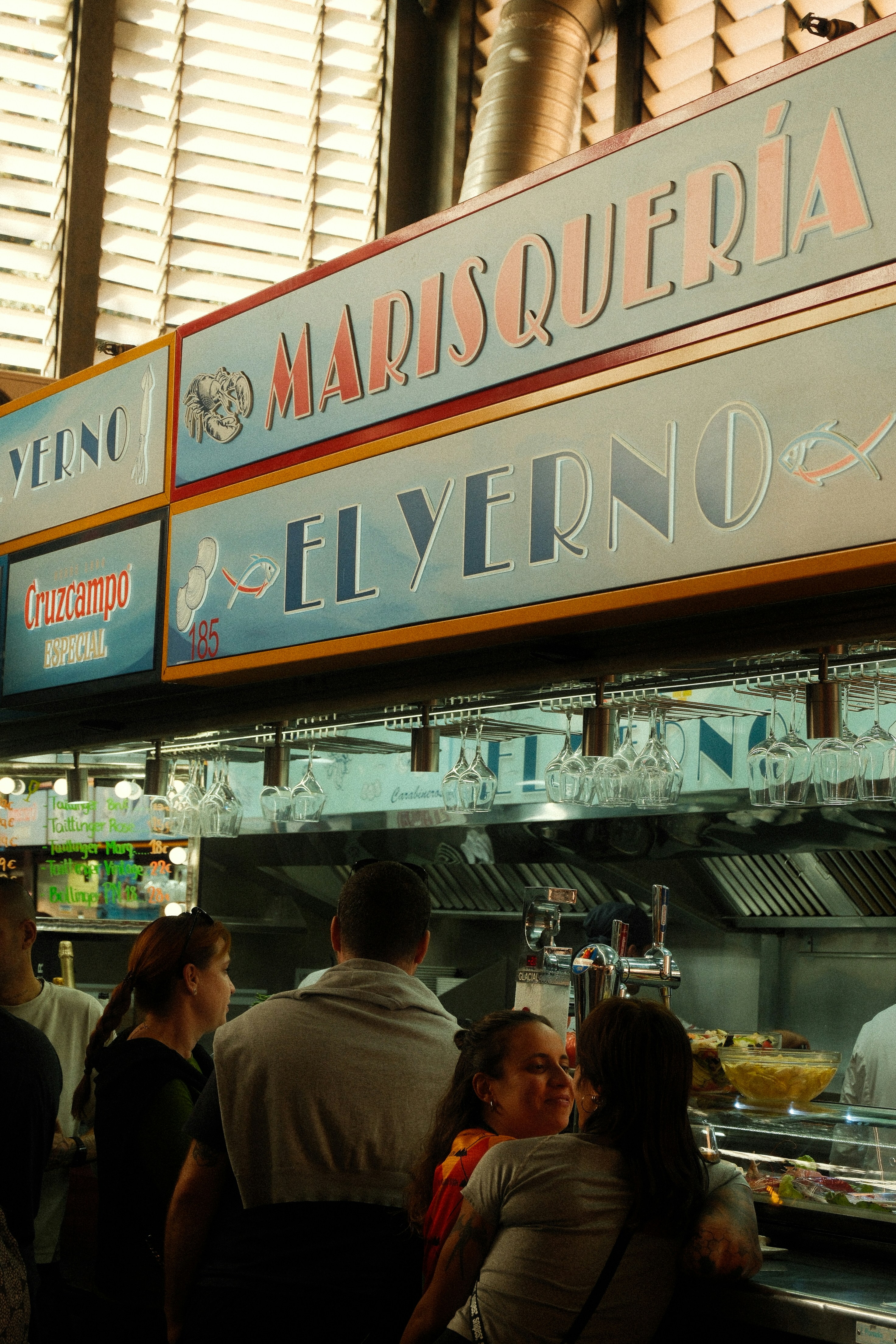 People at a seafood restaurant counter