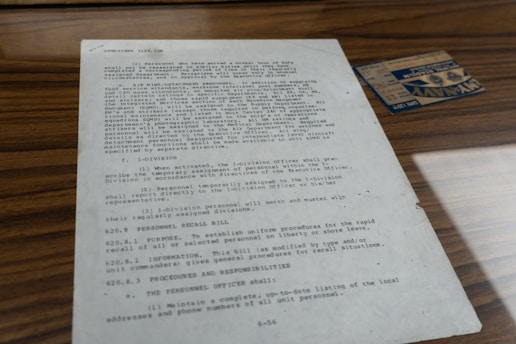 Old document with text and small card.