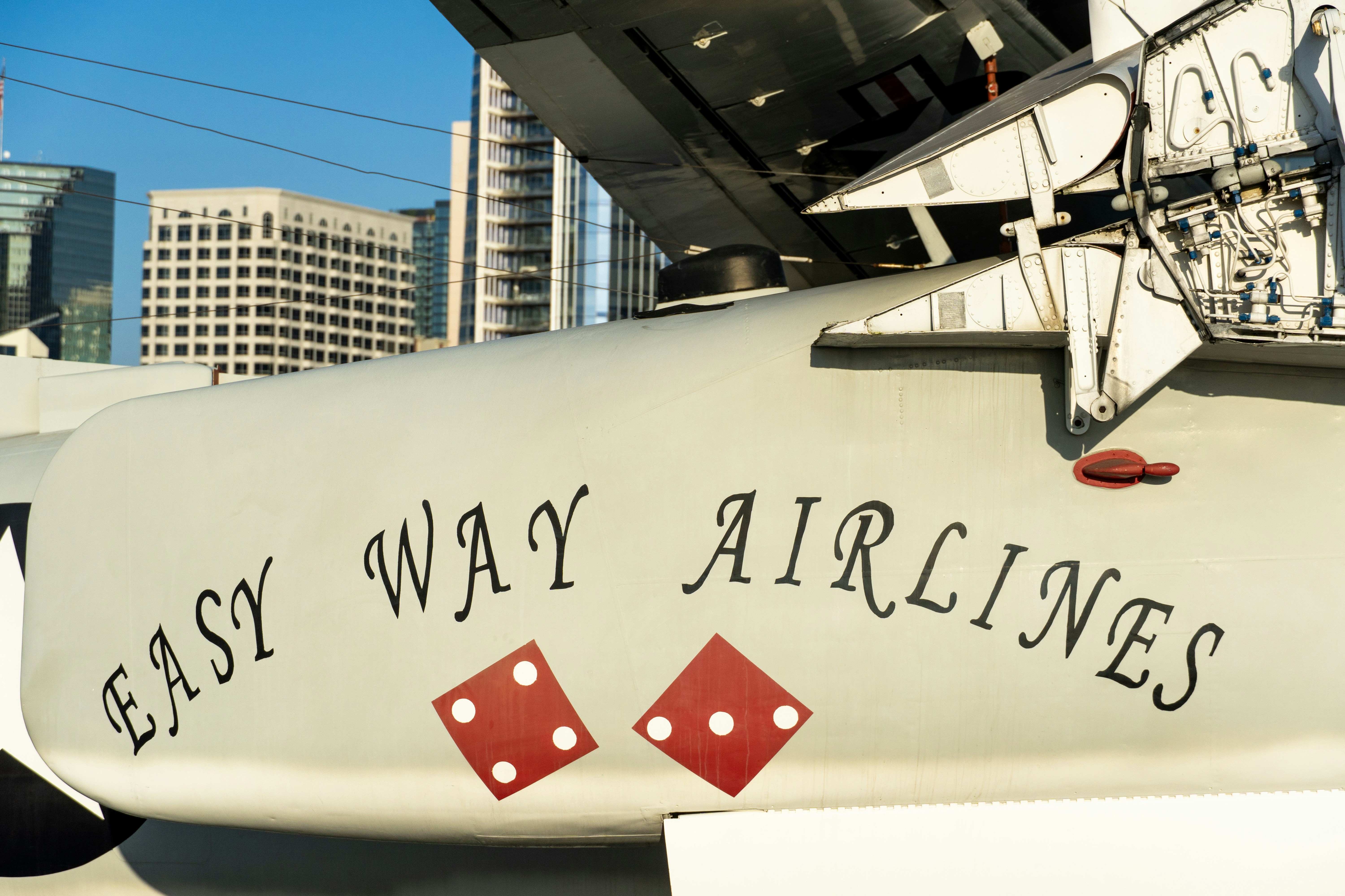 Airplane with "easy way airlines" and dice.