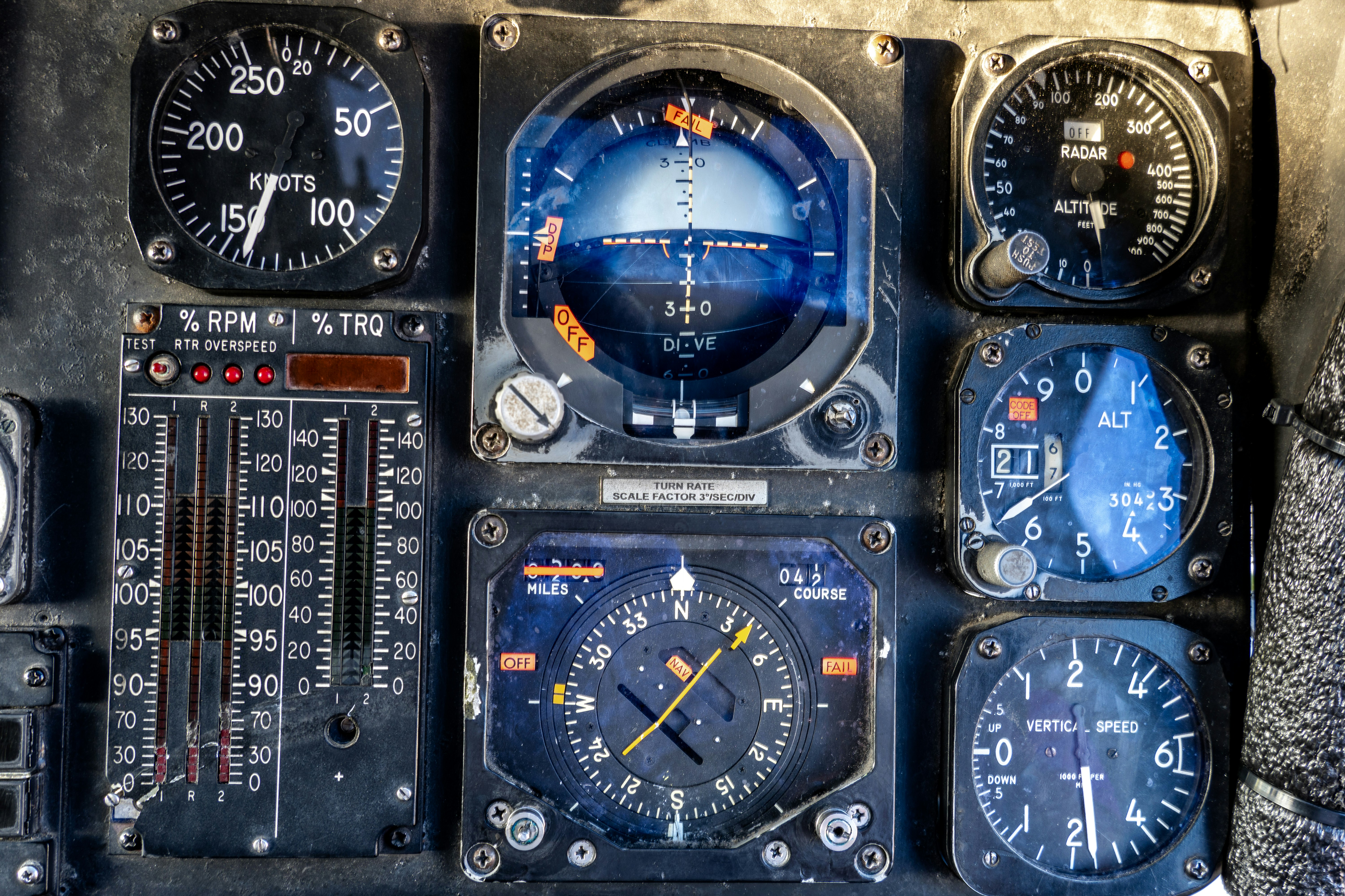 Close-up of vintage aircraft cockpit gauges and instruments.