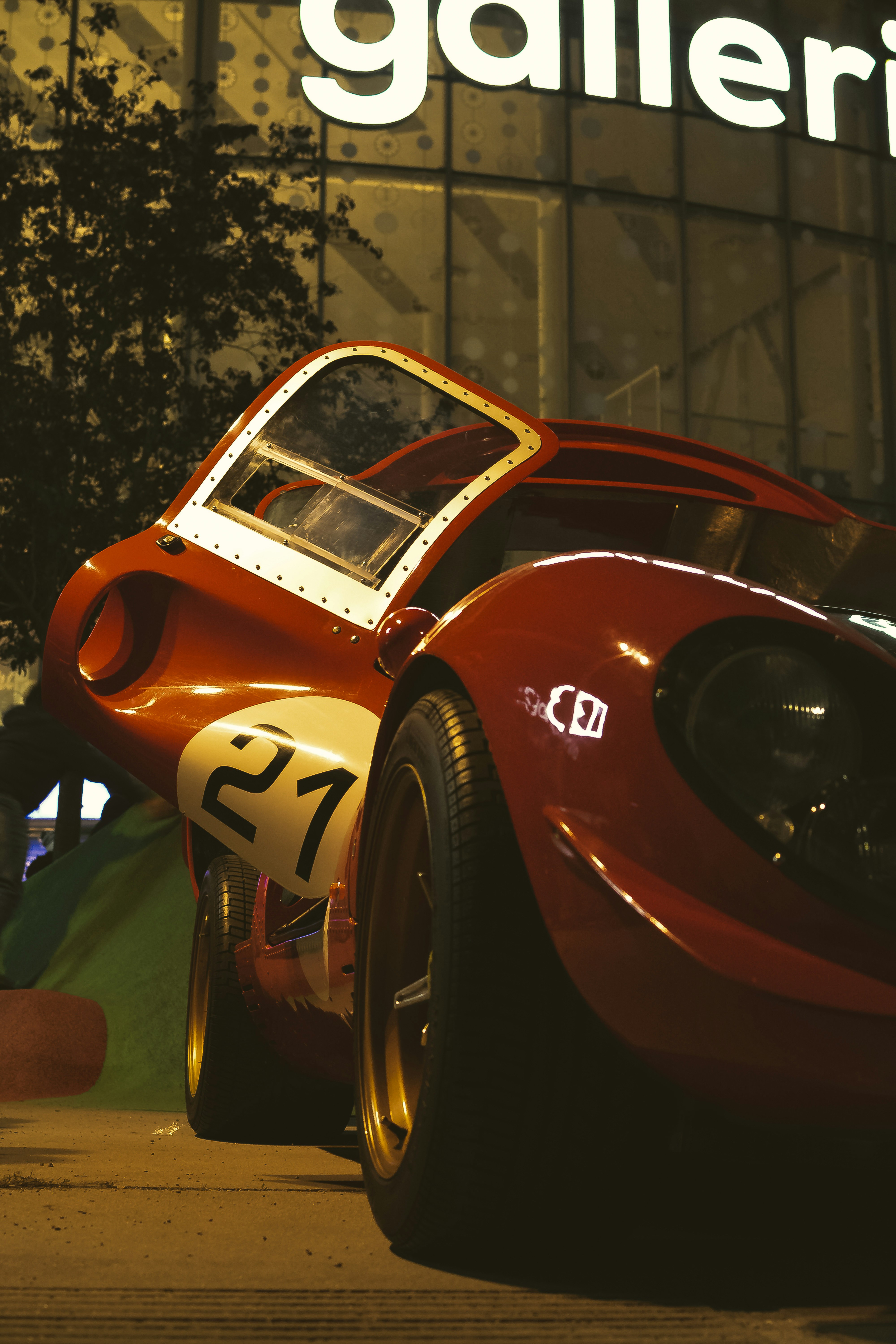 Red race car with number 21 on display