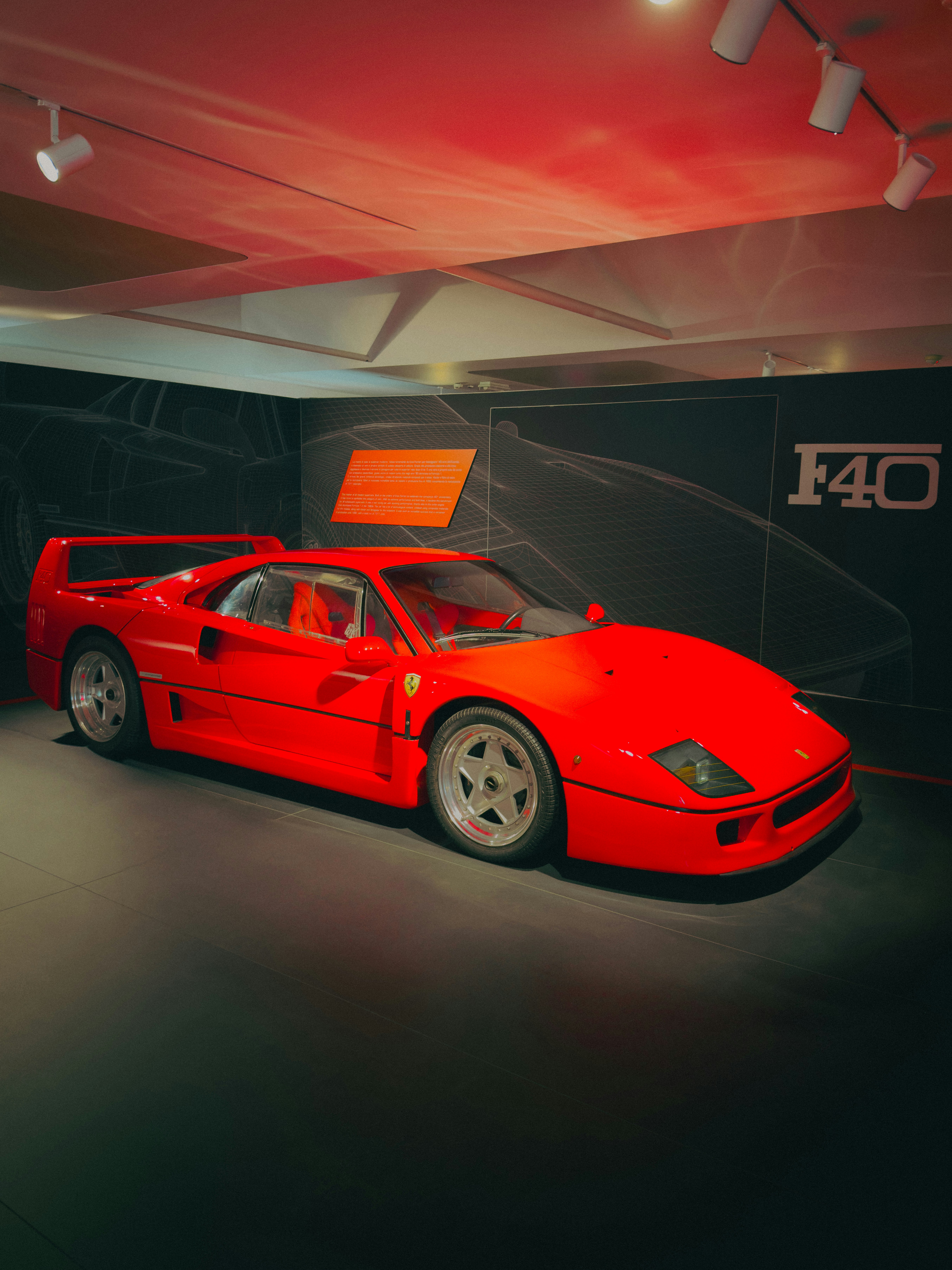 Red ferrari f40 sports car on display.