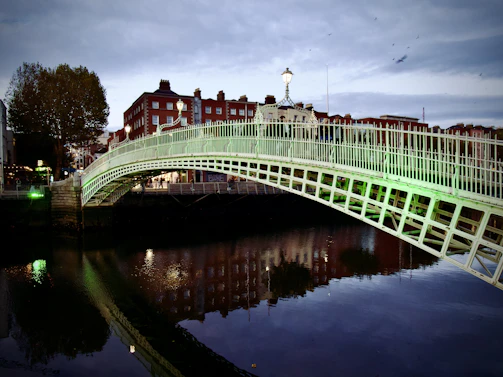 A bridge over a river at dusk.