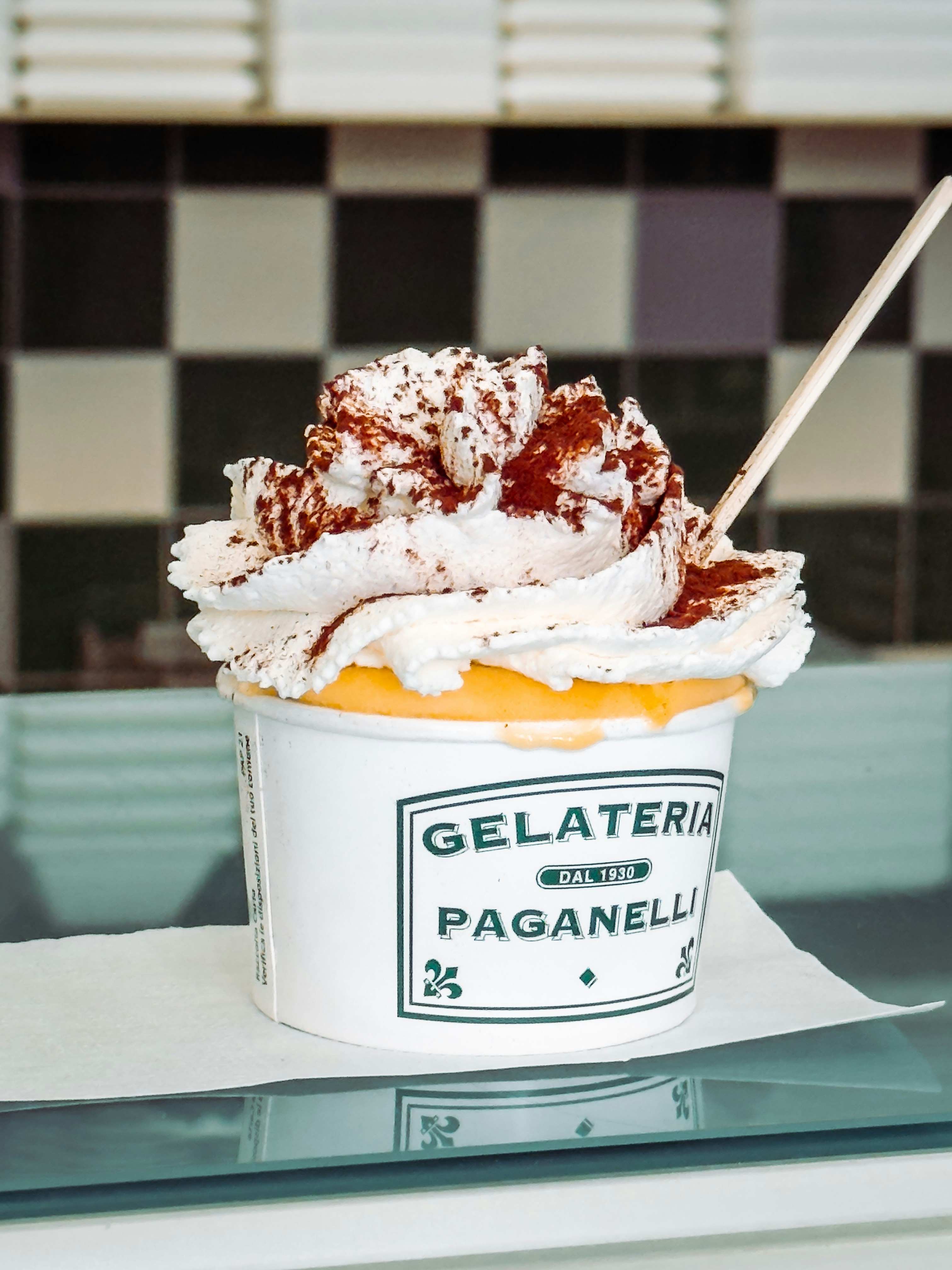 Dessert with whipped cream and cocoa powder