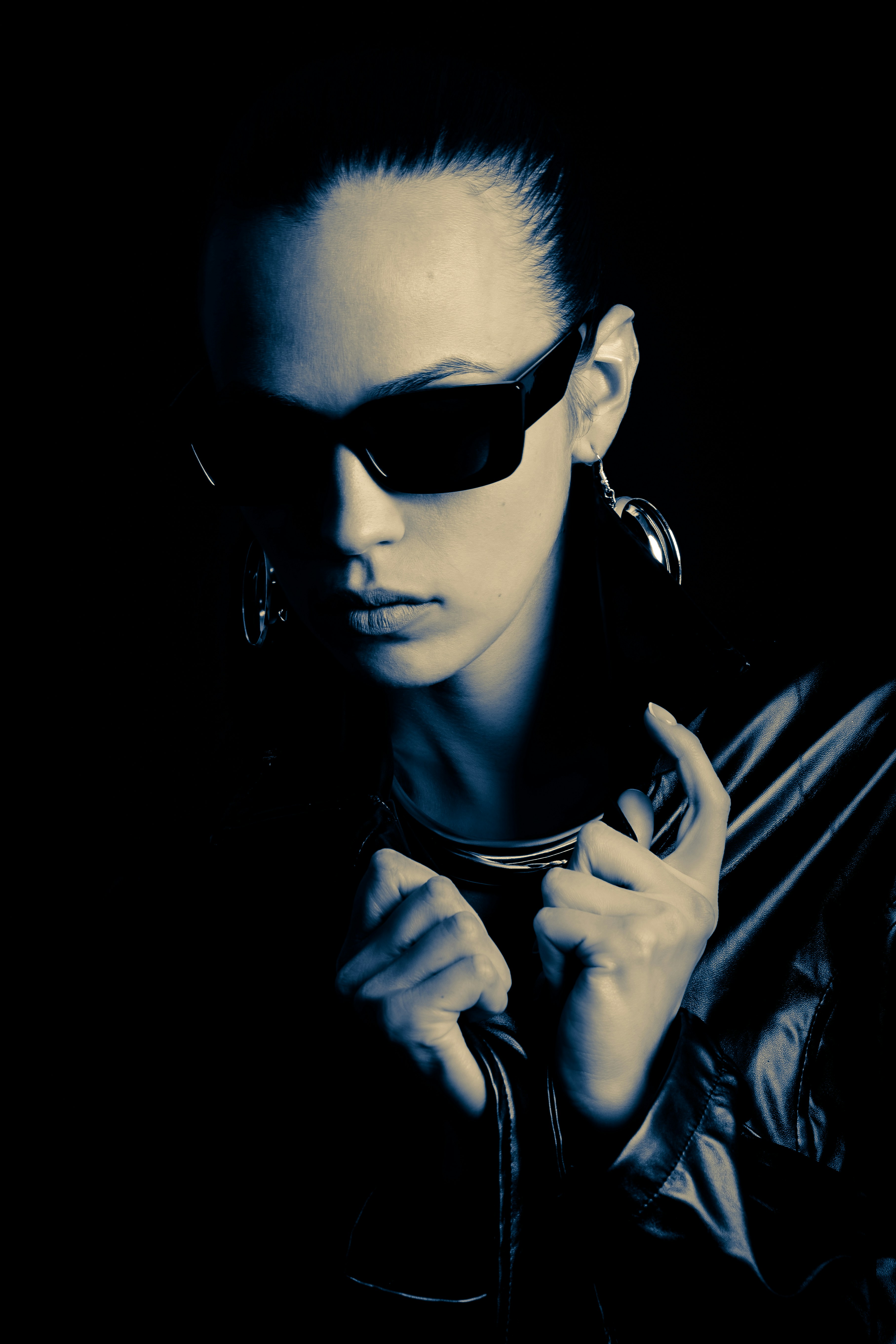 Woman in sunglasses and leather jacket