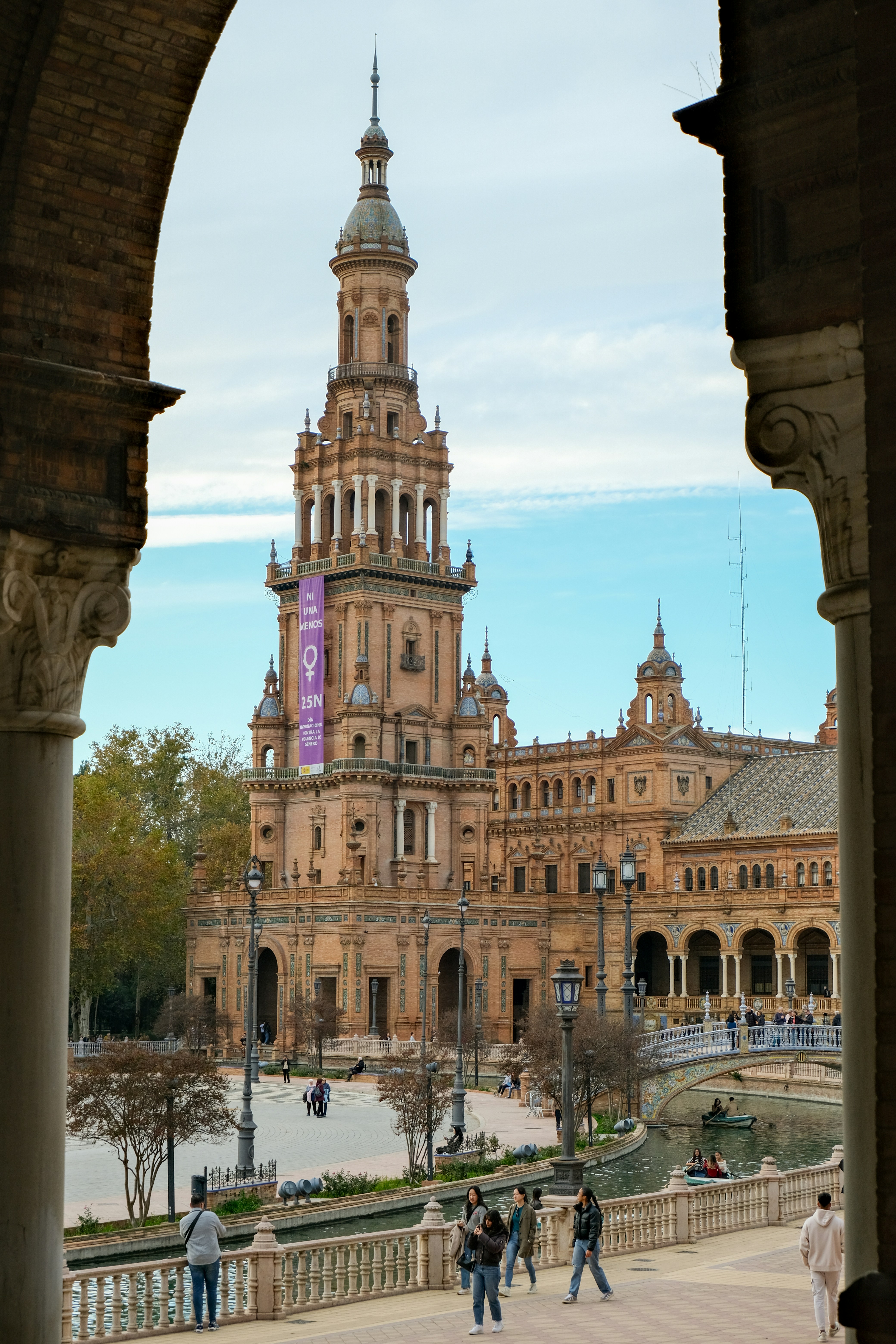 Ornate tower and building with banner under archway