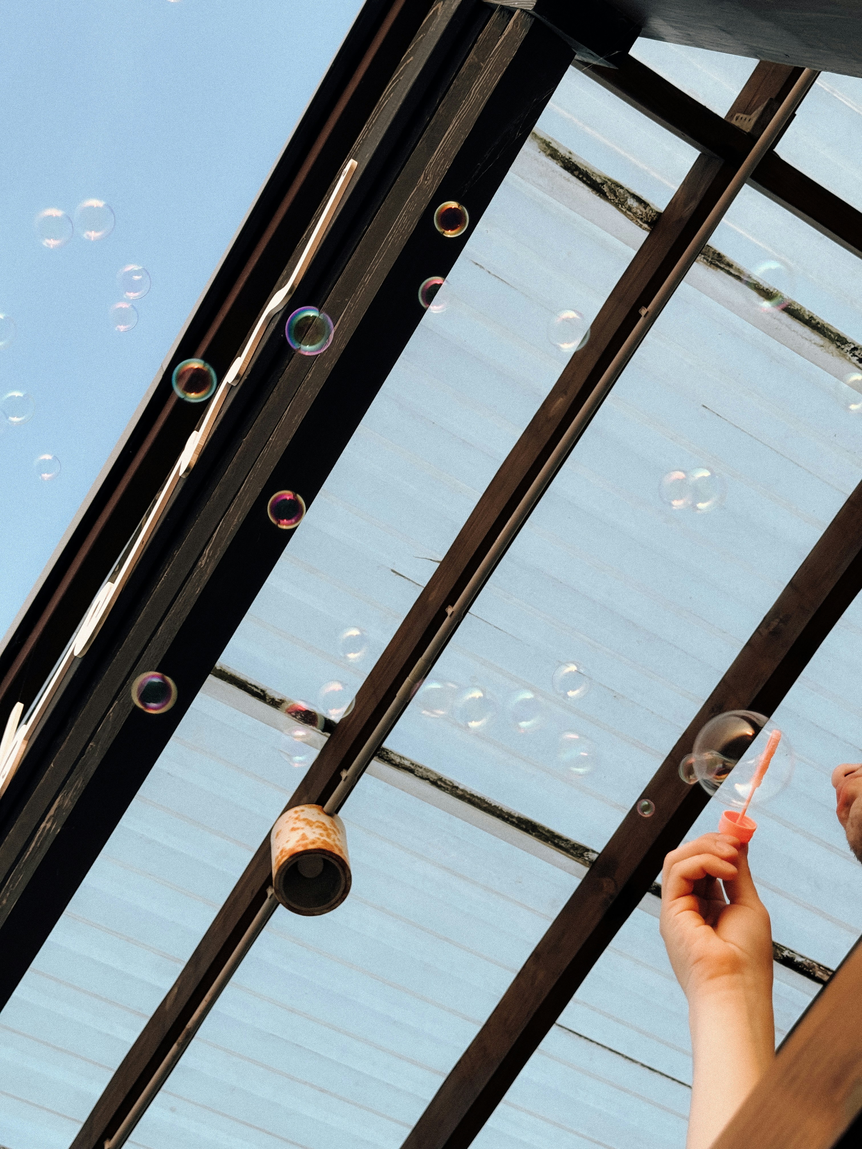 Bubbles floating up towards a clear sky.