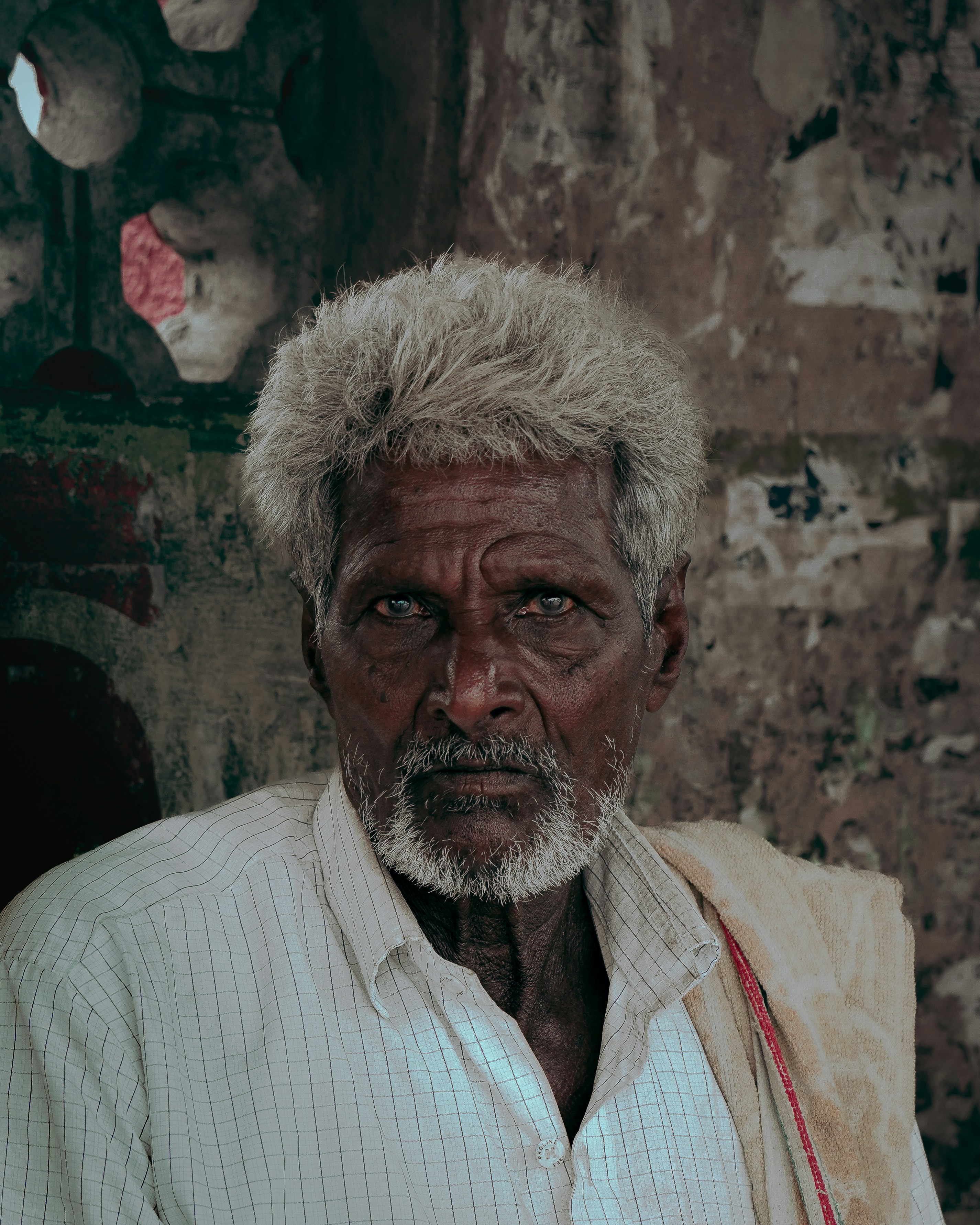 Elderly man with white hair and beard