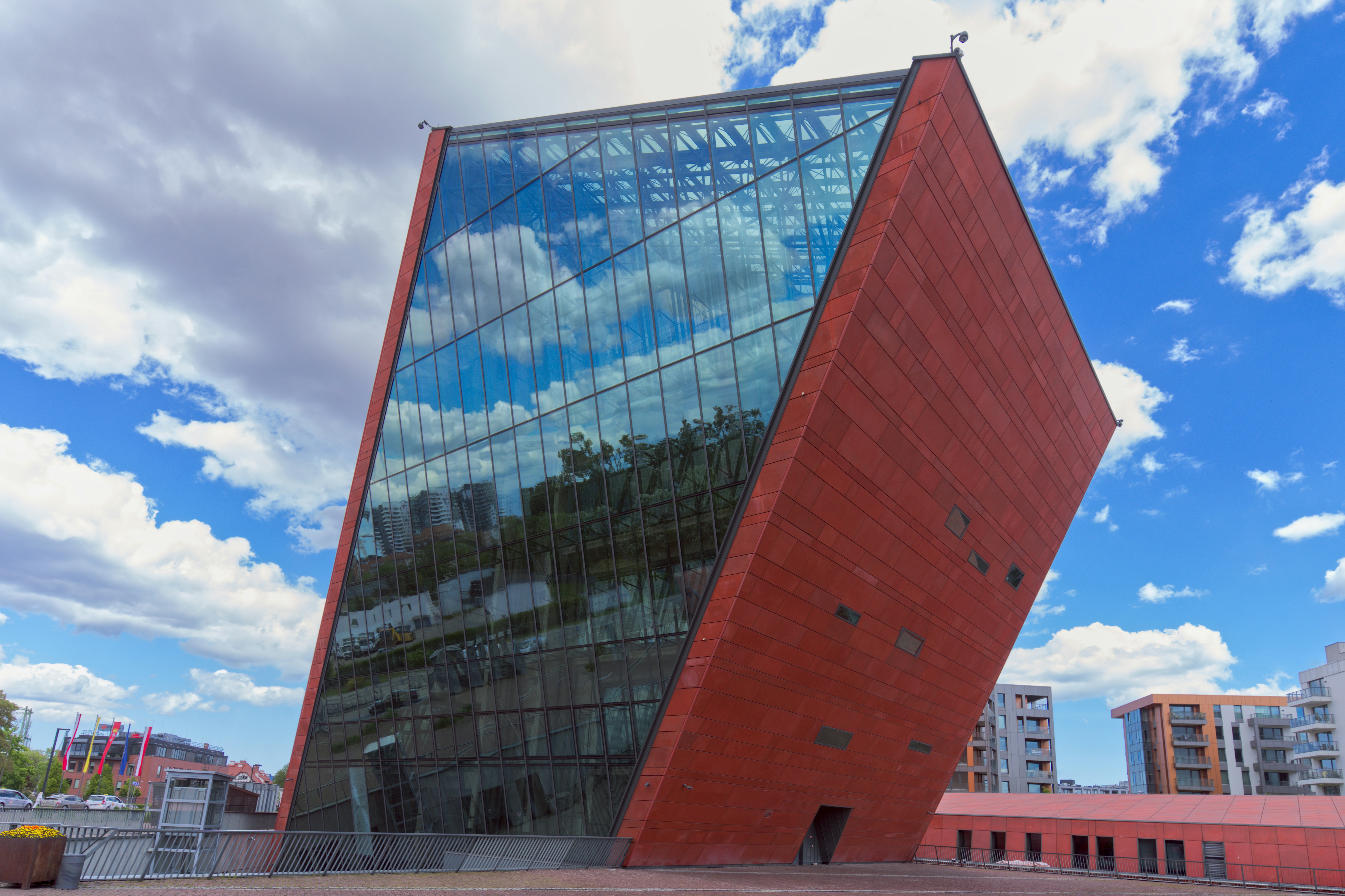 Modern building with glass and red brick facade