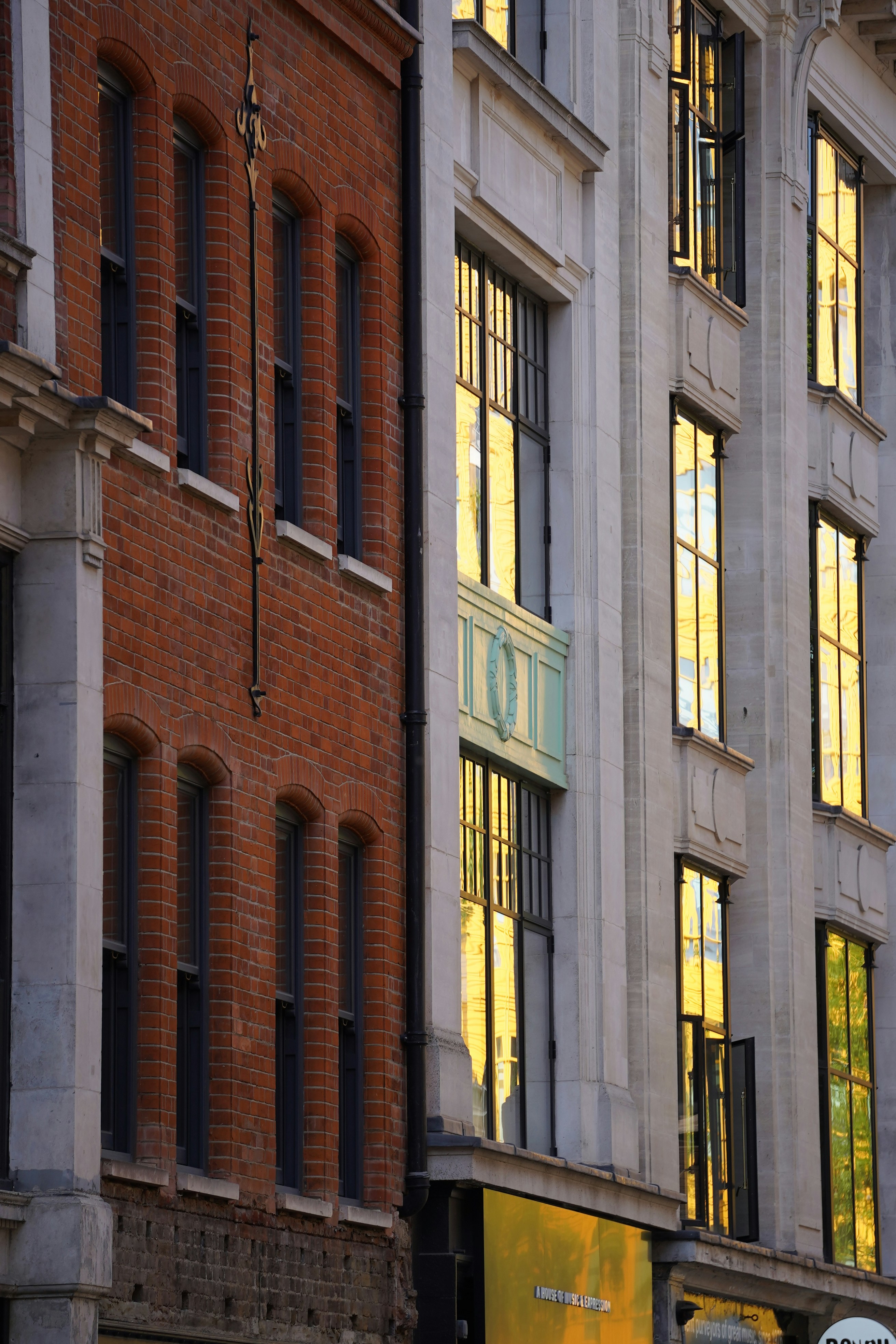 Brick and stone buildings with reflective windows