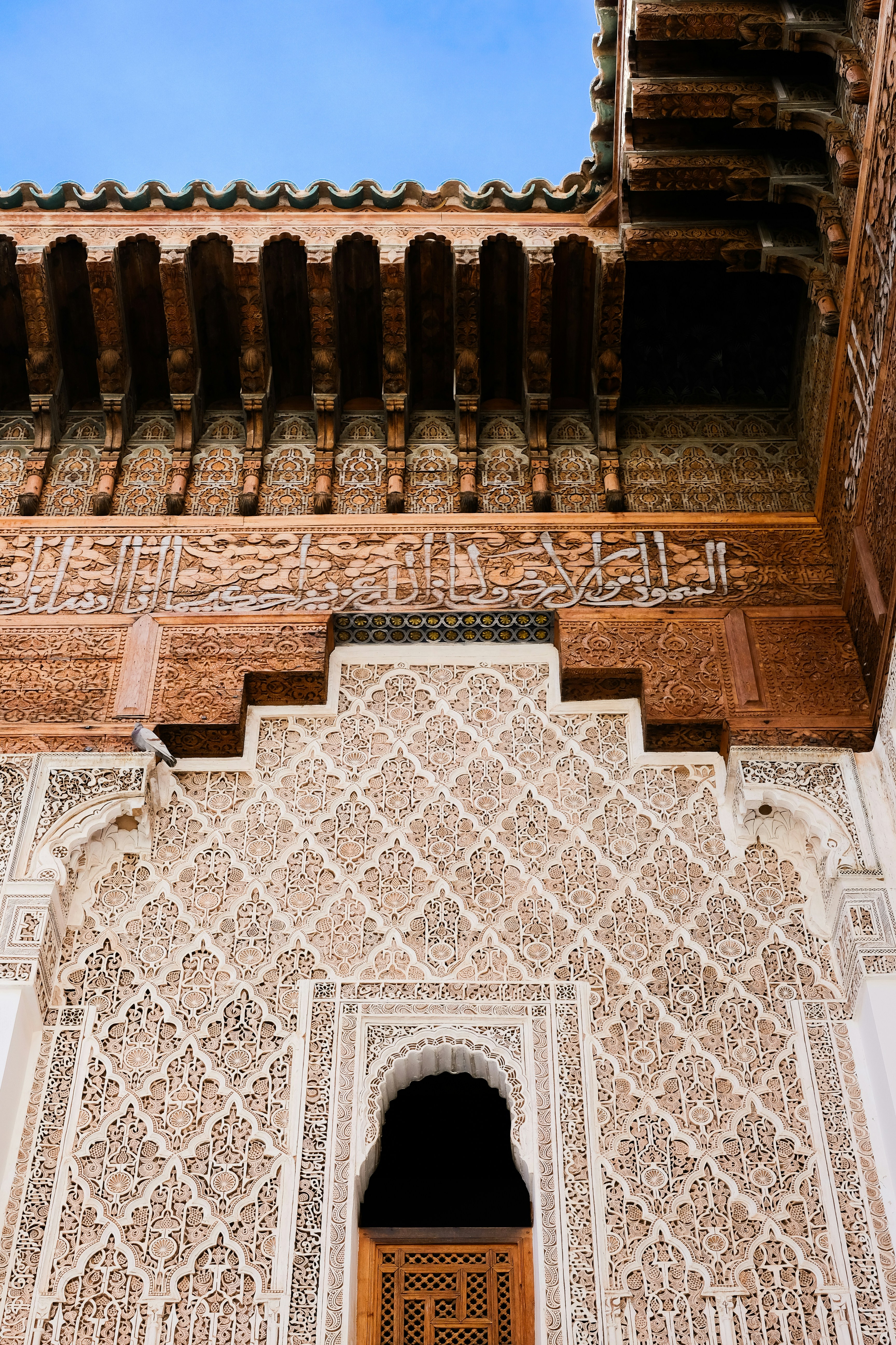 Intricate geometric carvings on an ornate building facade.