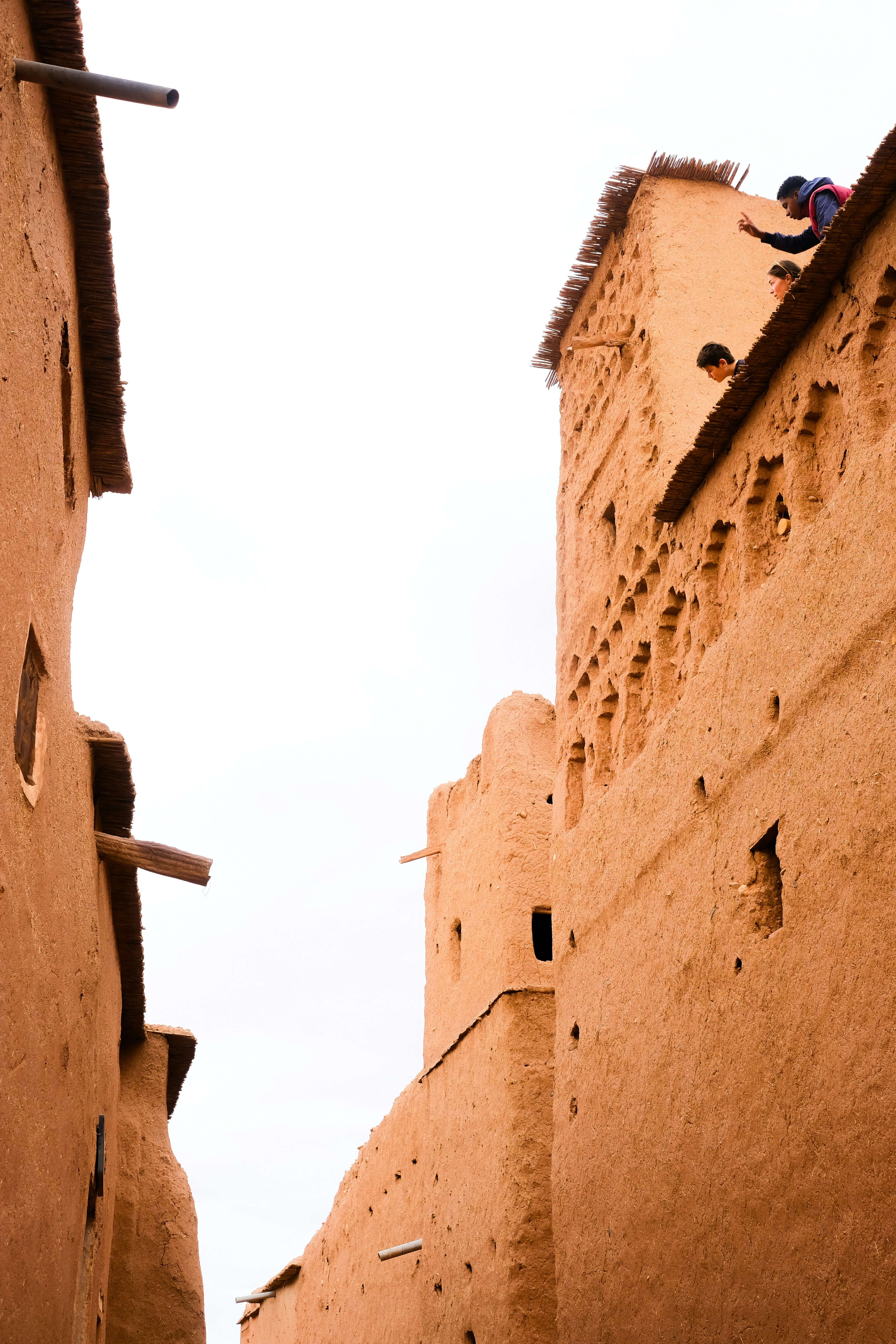 People on the roof of an old kasbah building