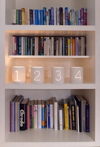 Bookshelves with decorative numbered candle holders