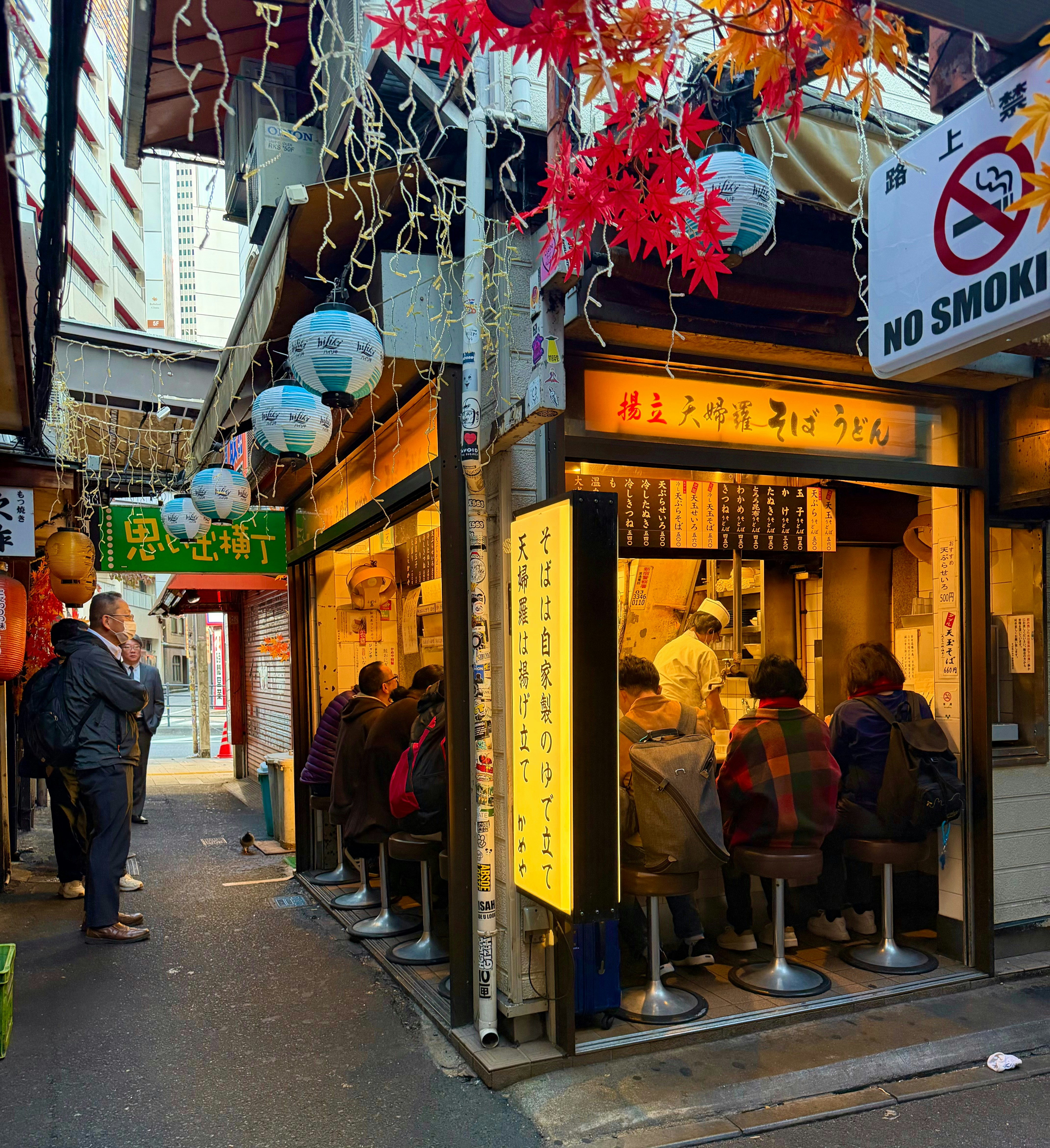 Locals and Travelers Interacting in Izakaya