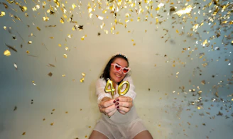 Woman celebrating 40th birthday with confetti
