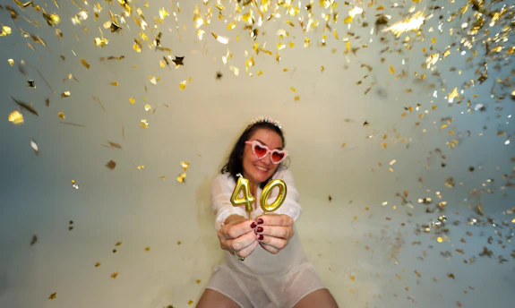 Woman celebrating 40th birthday with confetti
