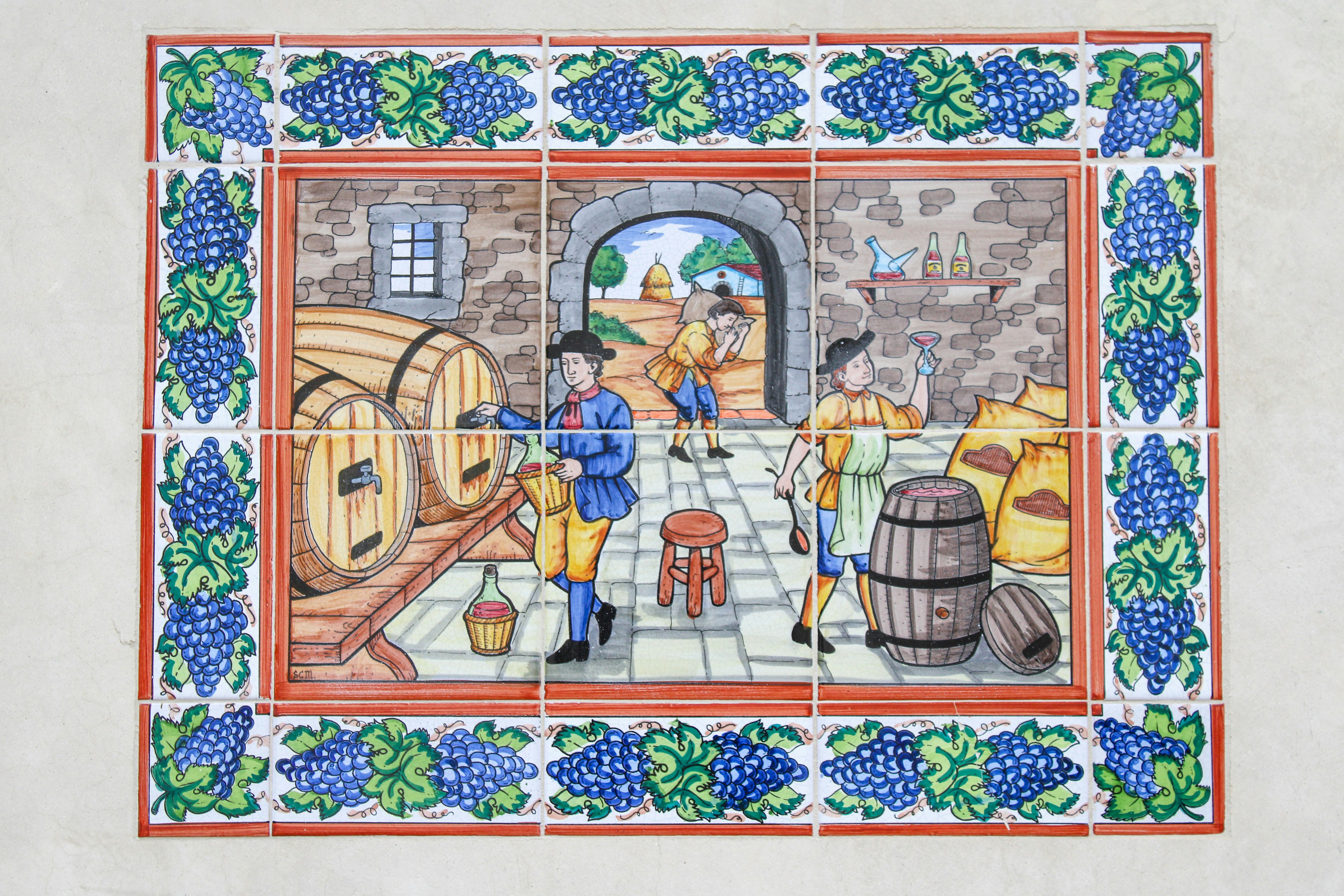 Vintage mural depicting winemaking process with barrels and workers
