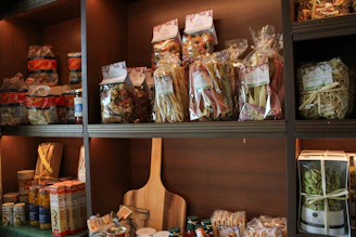 Shelves filled with packaged food items and jars.