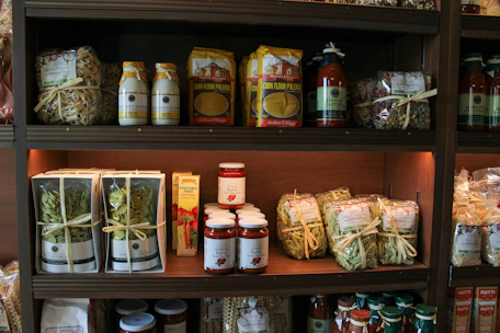 Shelves of packaged food items and jars