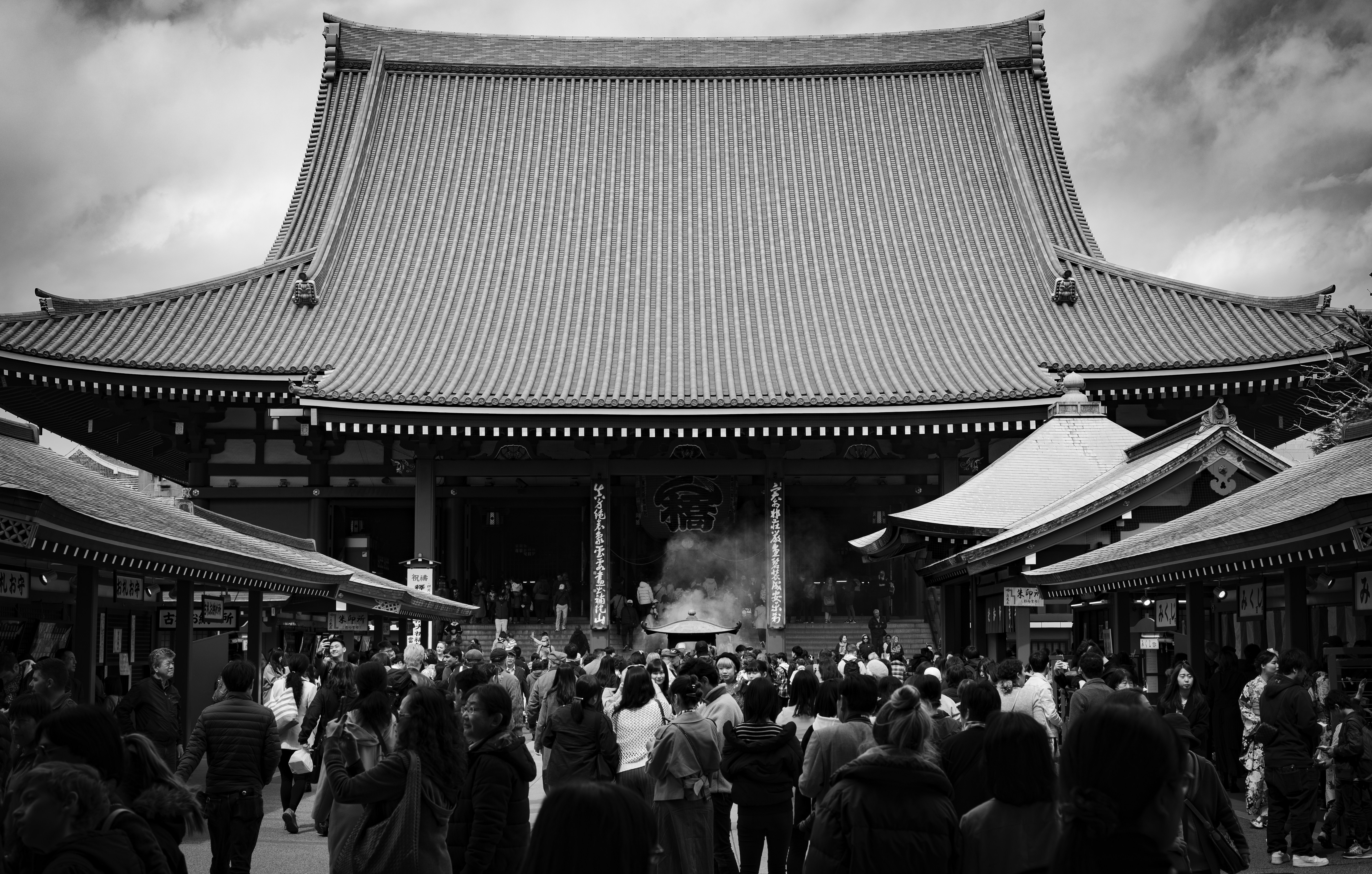 Crowded temple courtyard with traditional architecture