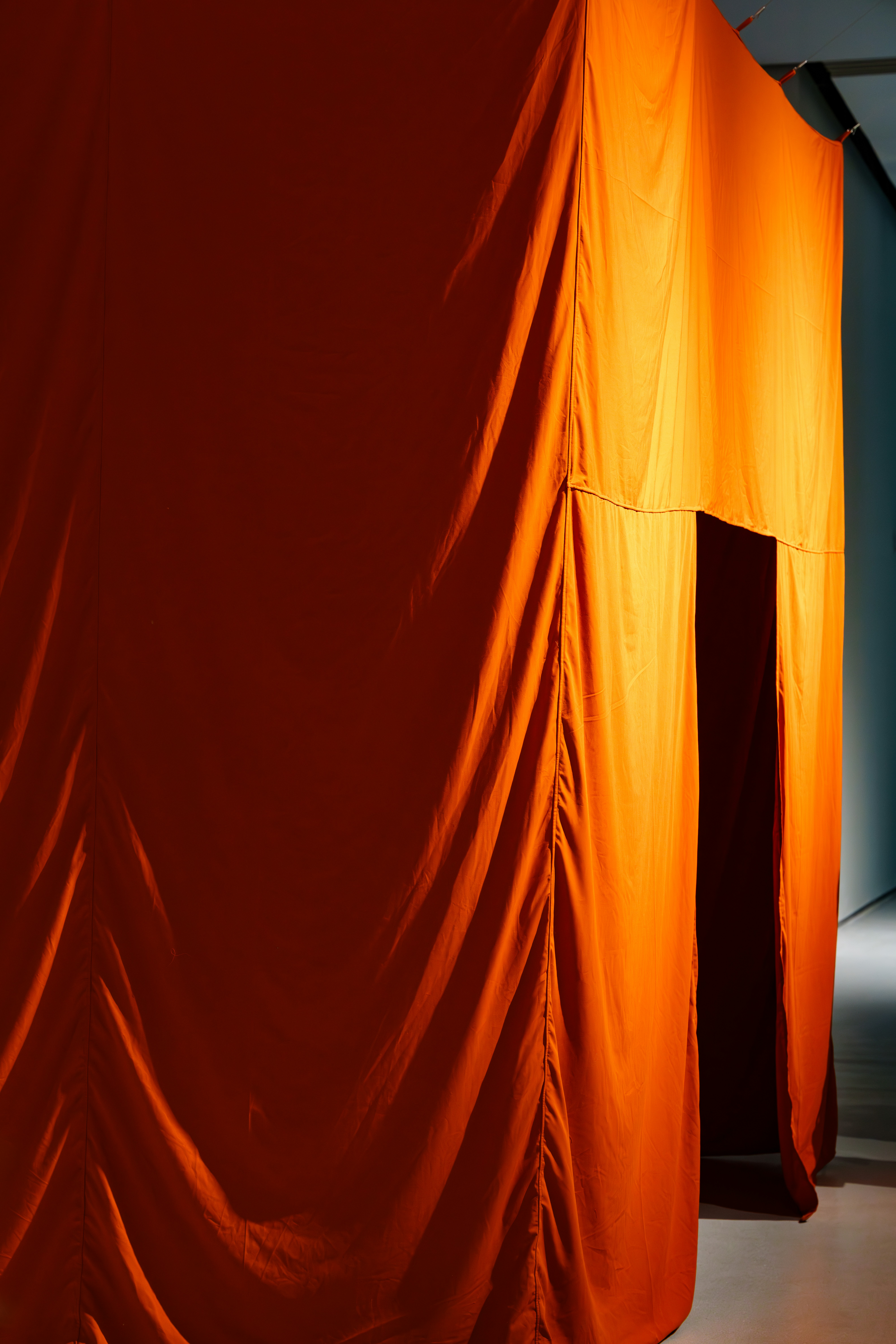 Orange fabric draped over an entrance