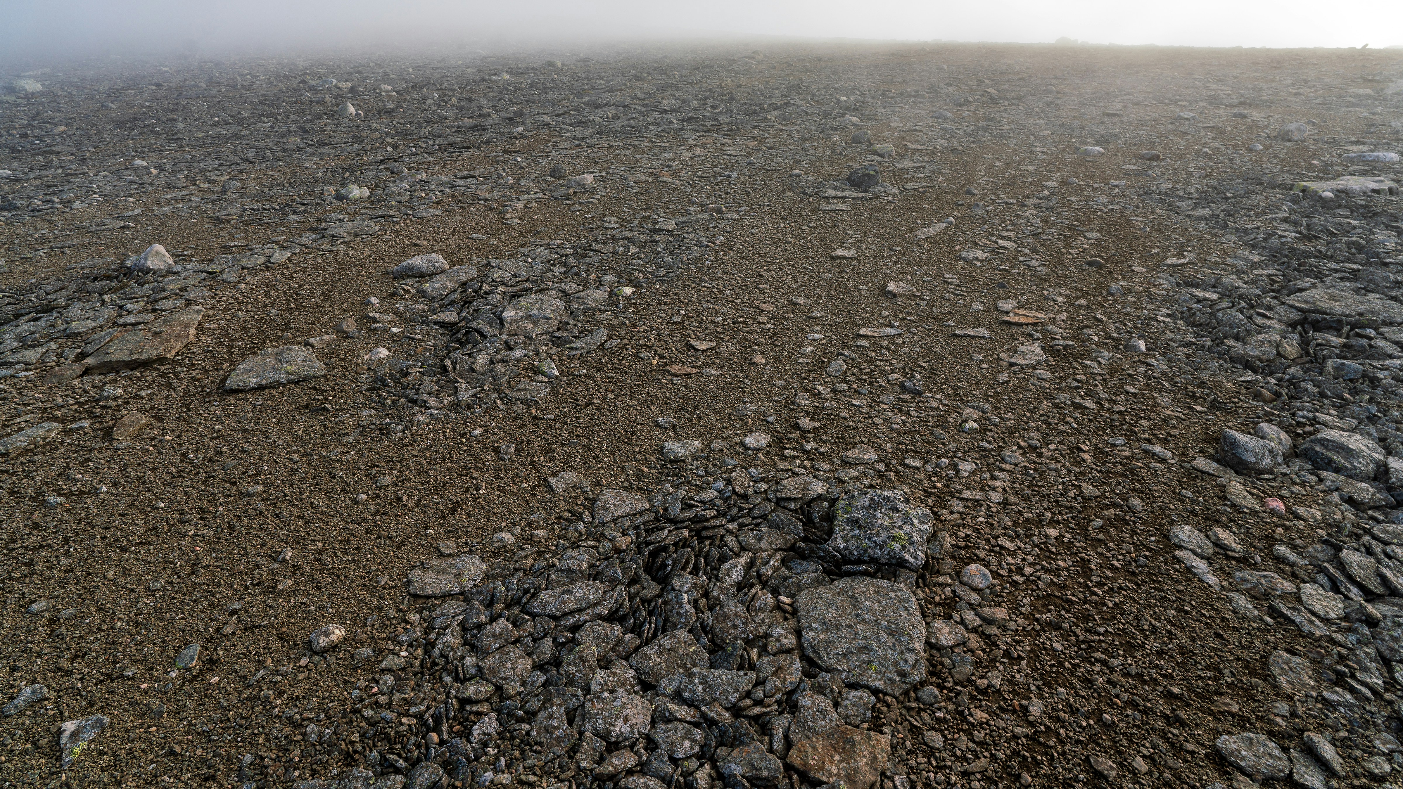 Rocky ground with a foggy horizon