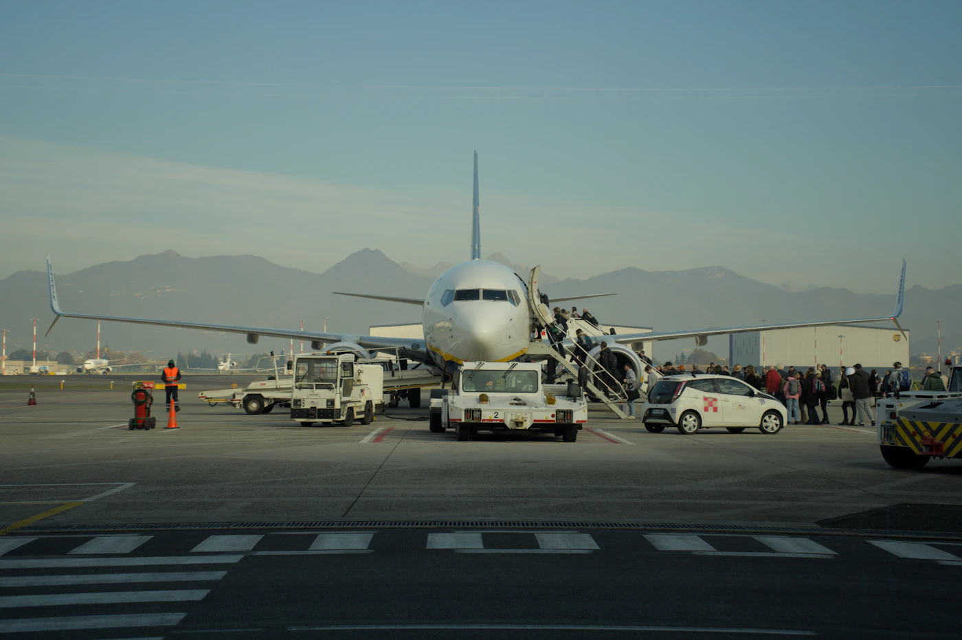 Passengers boarding a Ryanair aircraft while considering booking changes and cancellation options - Photo from Unsplash