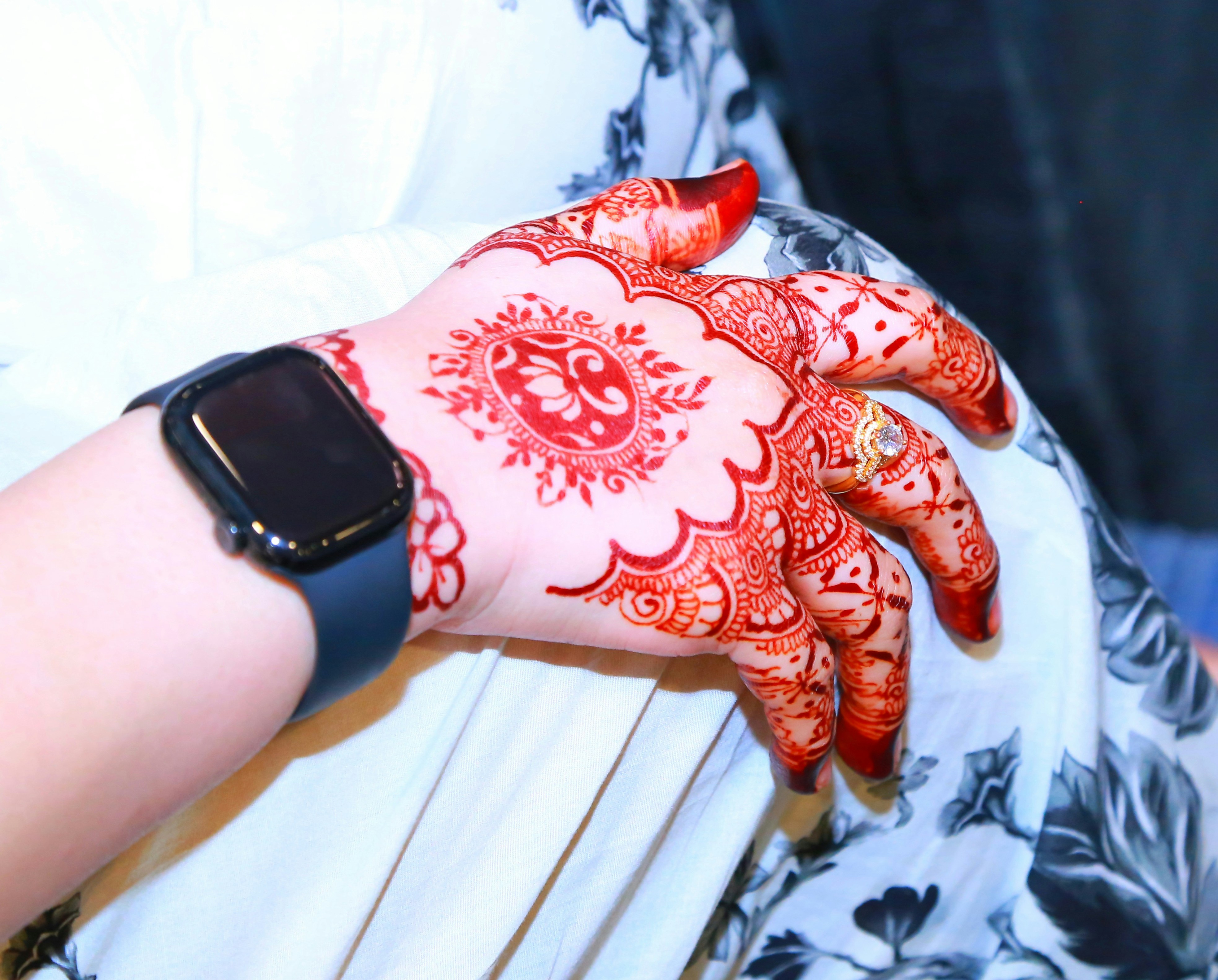 Woman's Hand with Intricate Henna Design and Smartwatch