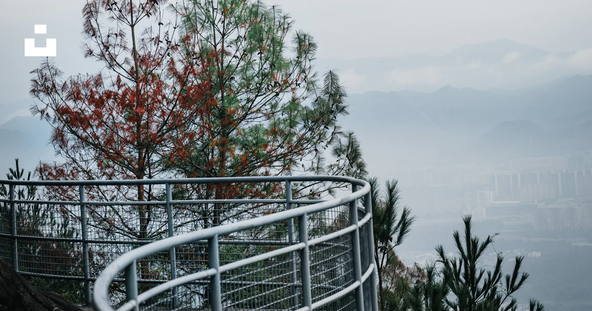 Curving metal railing on a mountain overlook photo – Free Mountains ...