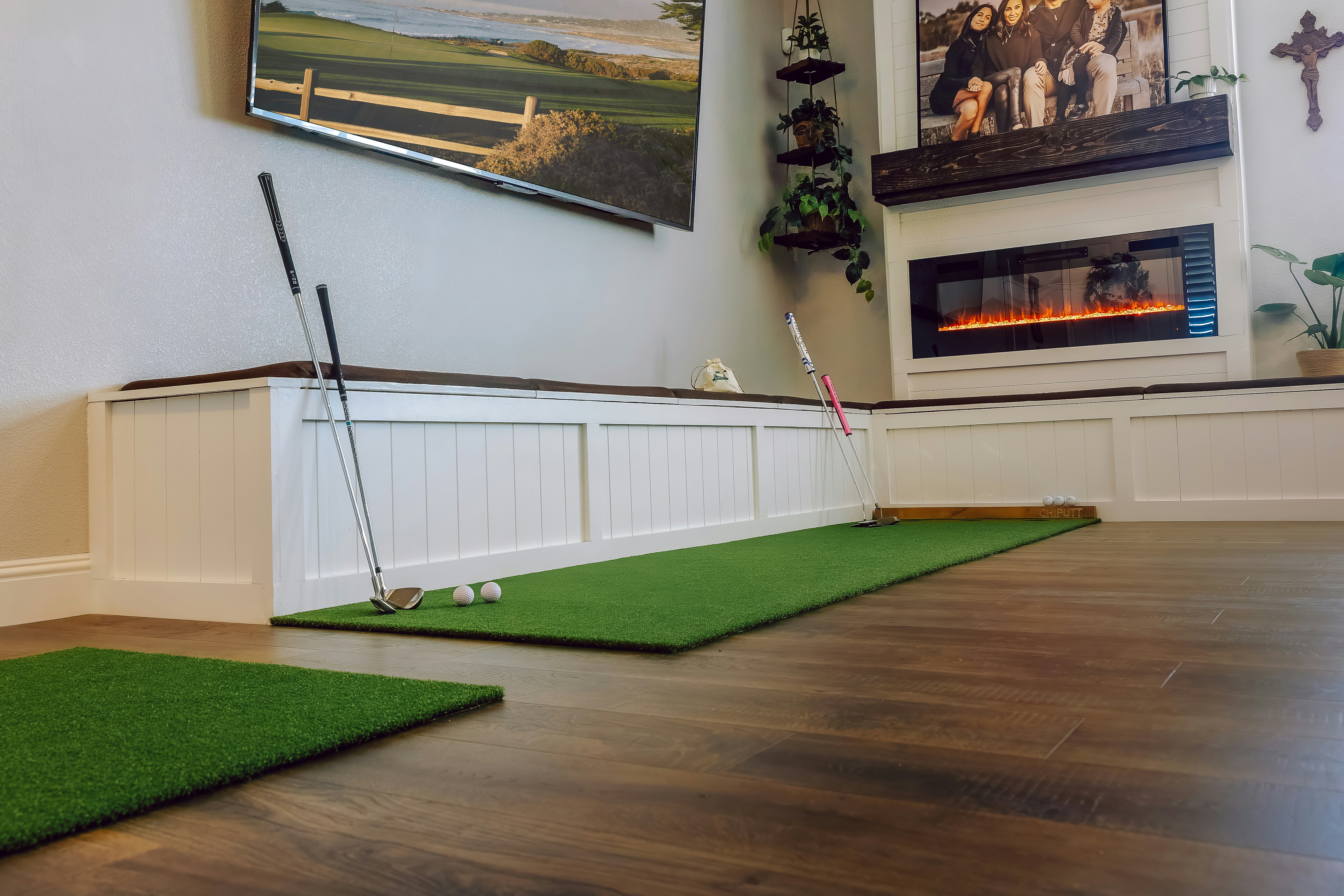 Golf putting green set up in a living room.