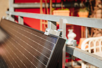 Solar panel being installed on a metal frame.