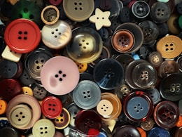 A collection of colorful buttons of various sizes.