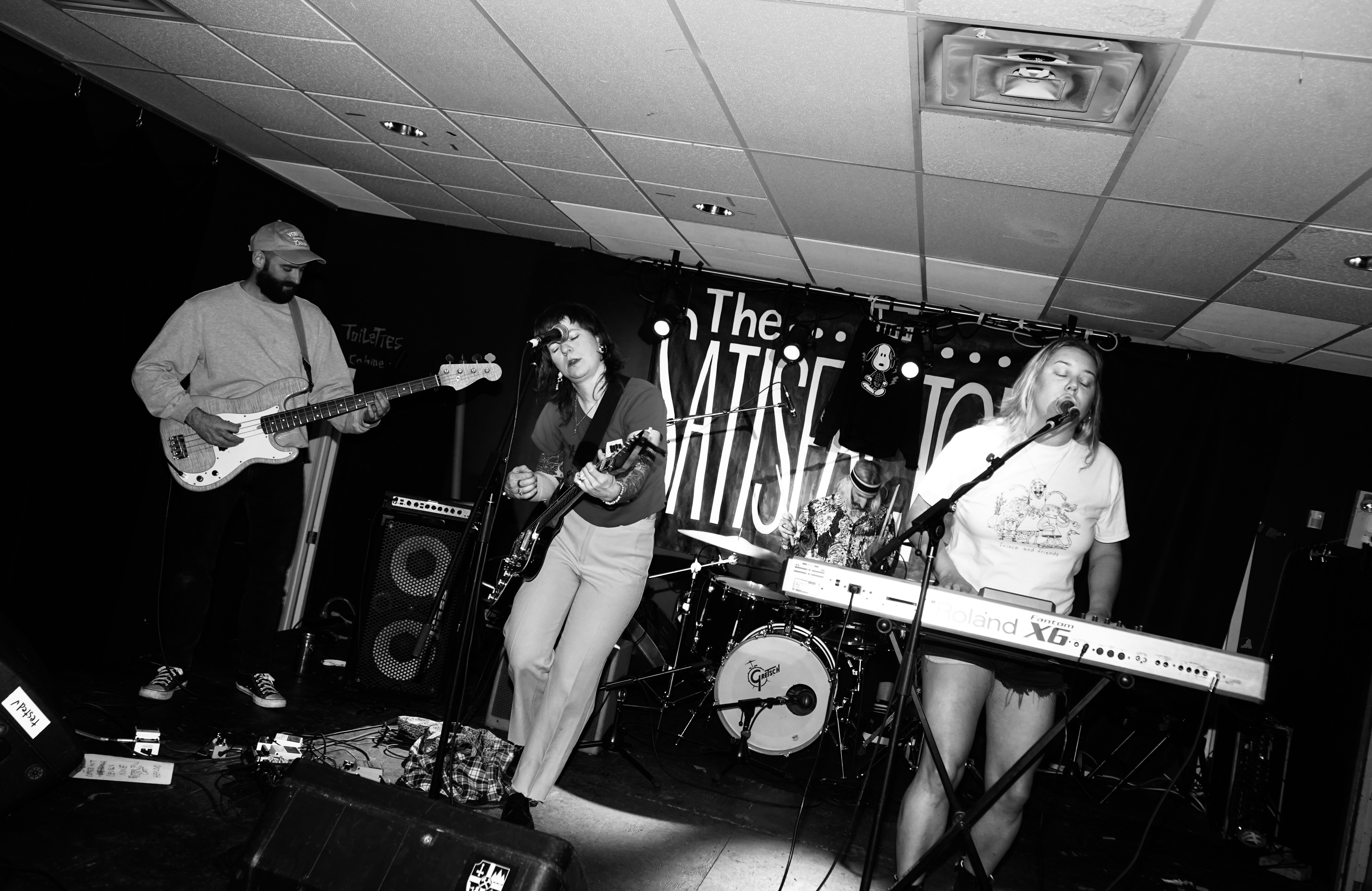 Band performing on stage with instruments