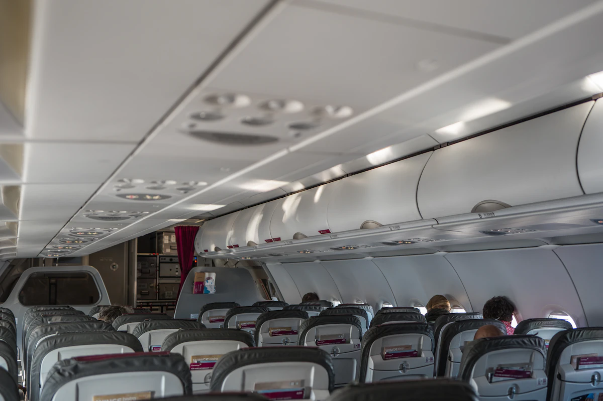 Empty airplane cabin with rows of seats