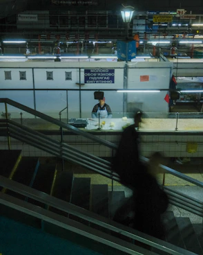 People moving on stairs in a bustling market