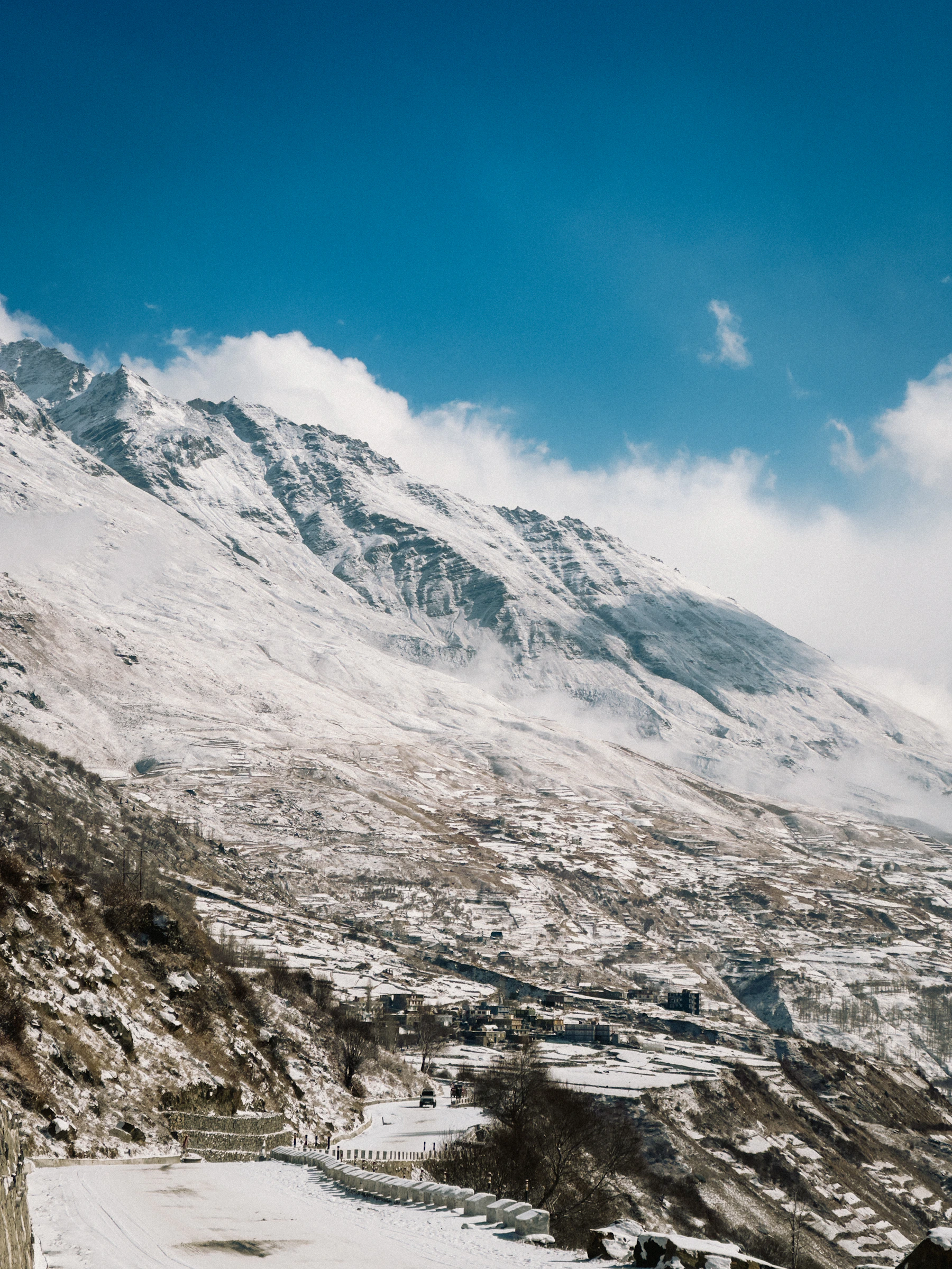 Snow-covered mountains and villages on the Winter Spiti route