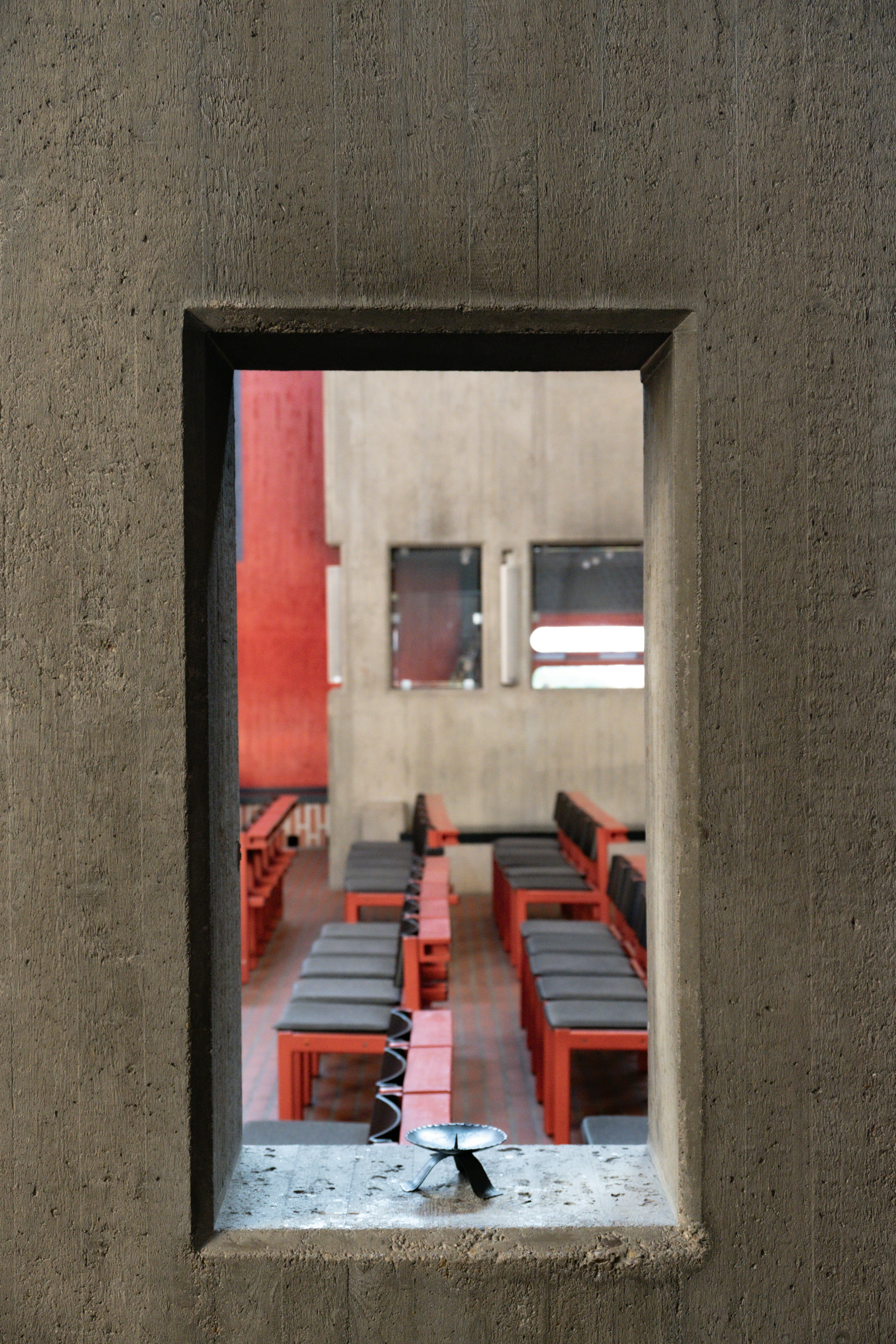 Rows of empty seats in a concrete building