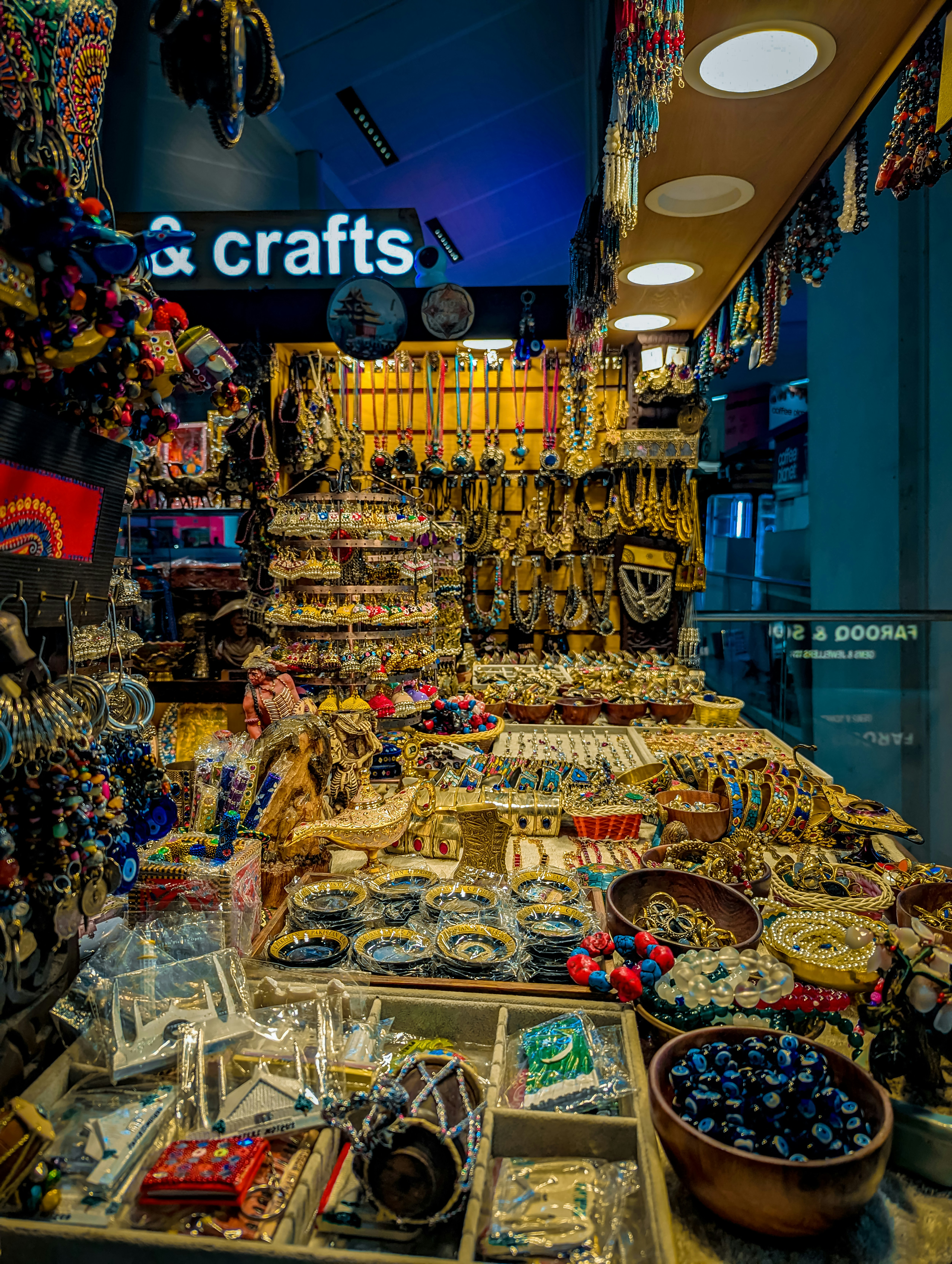 Colorful handmade crafts and souvenirs displayed in a market stall.