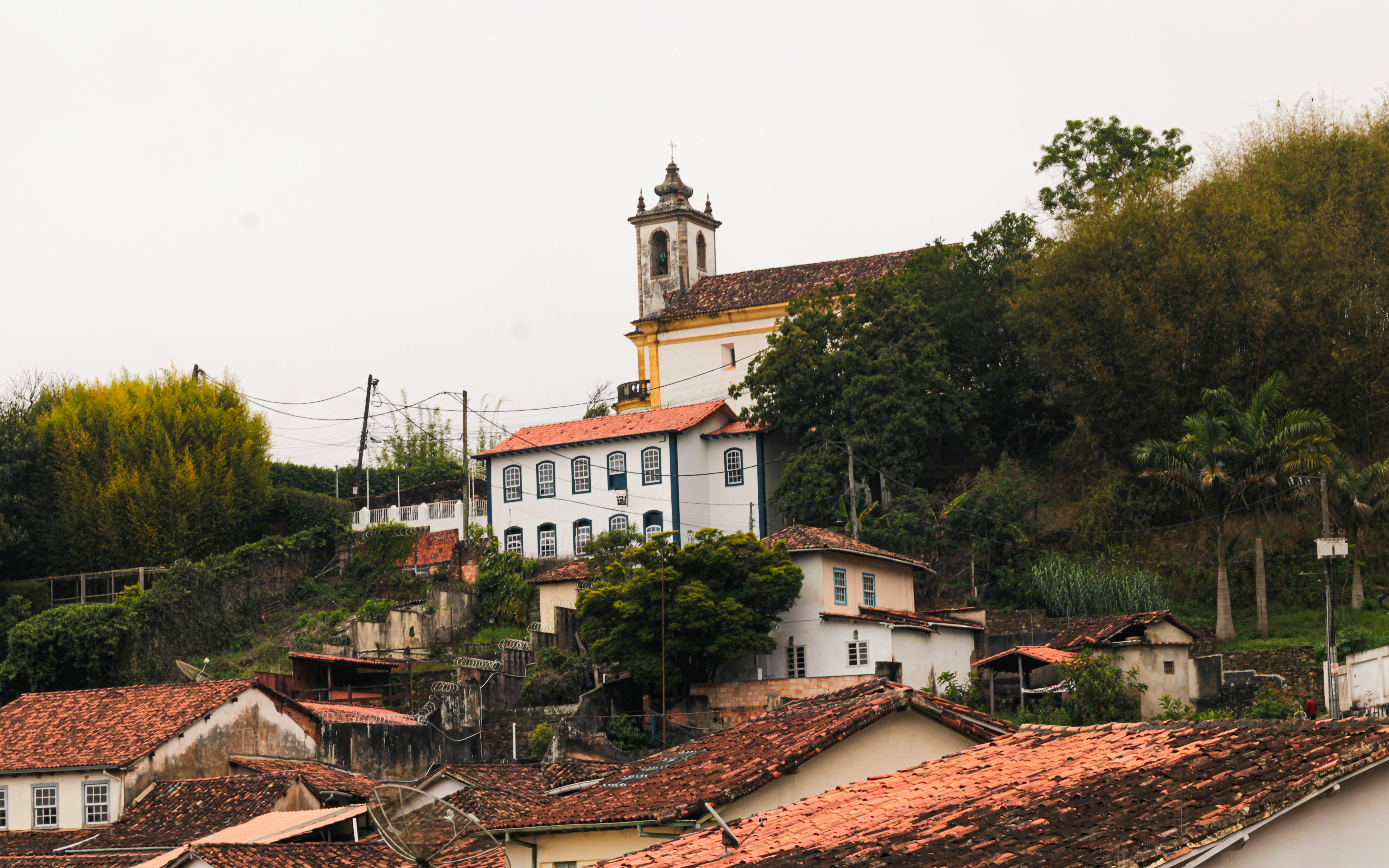 Historic buildings on a hillside with a church.