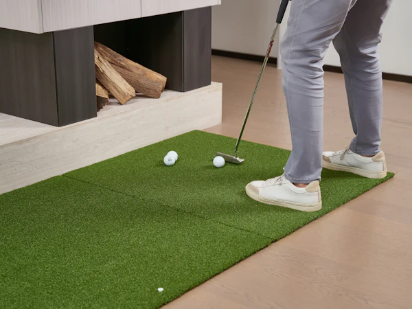 Coach demonstrating golf swing