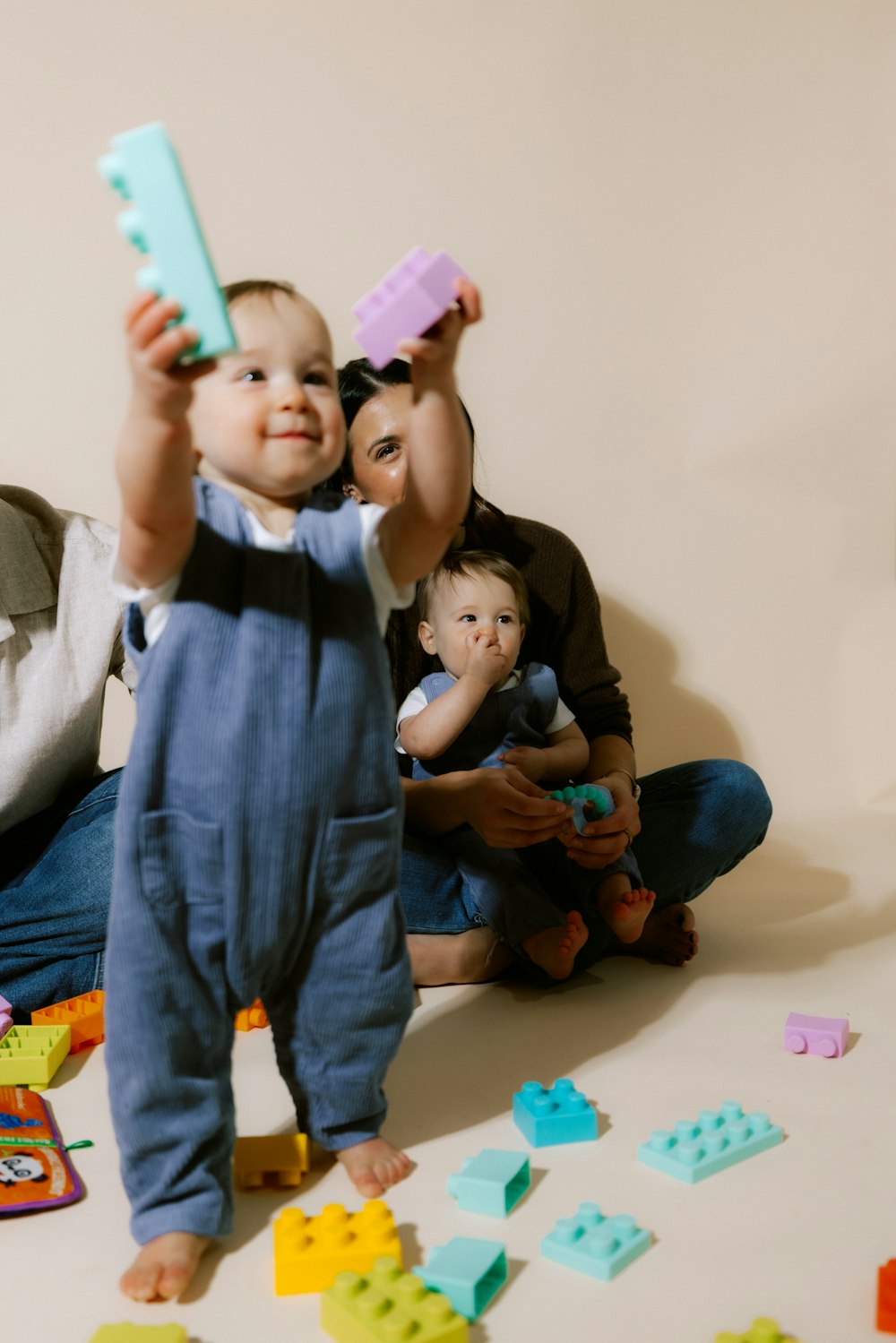 A toddler playing with building blocks