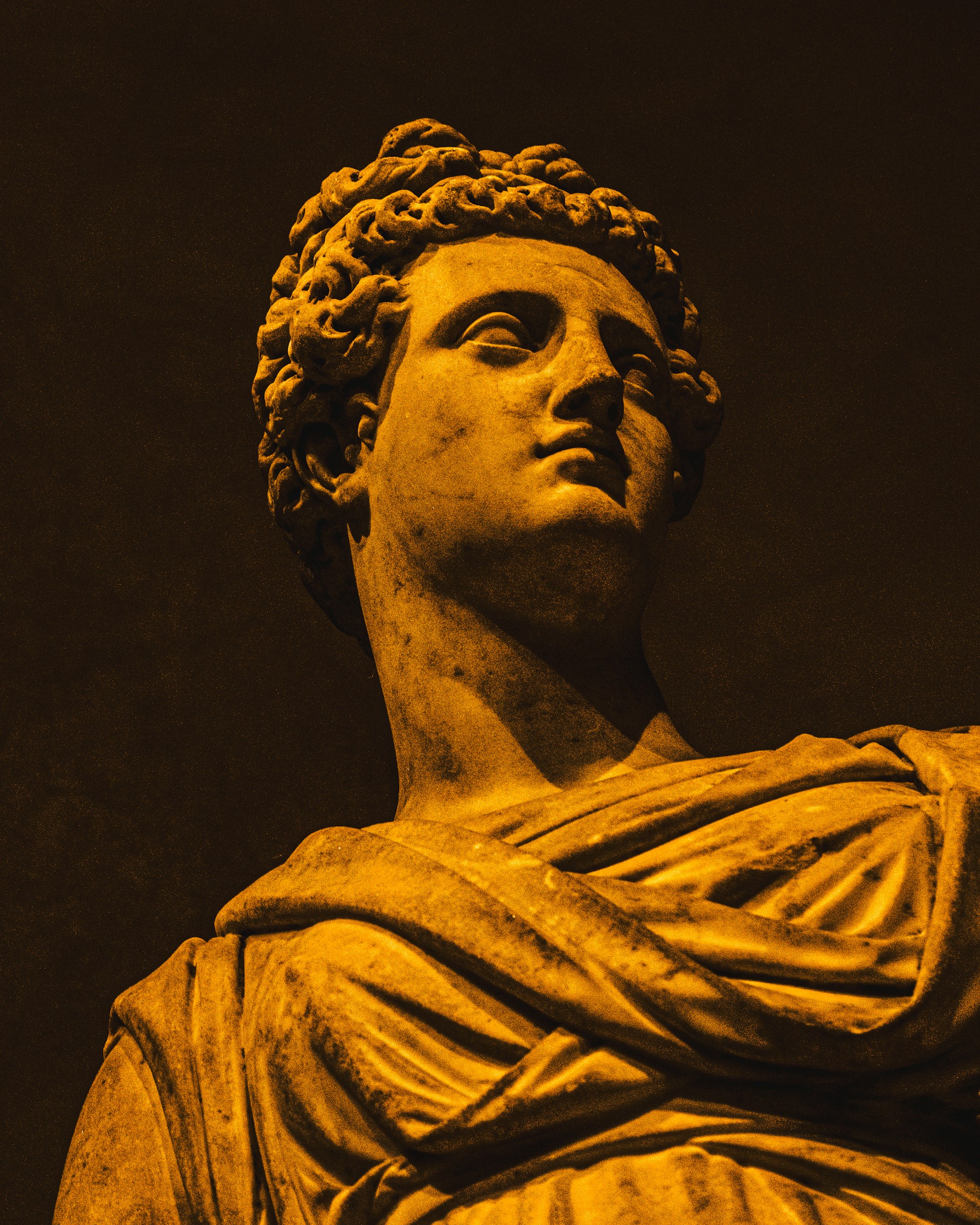 Marble statue of a woman with curly hair