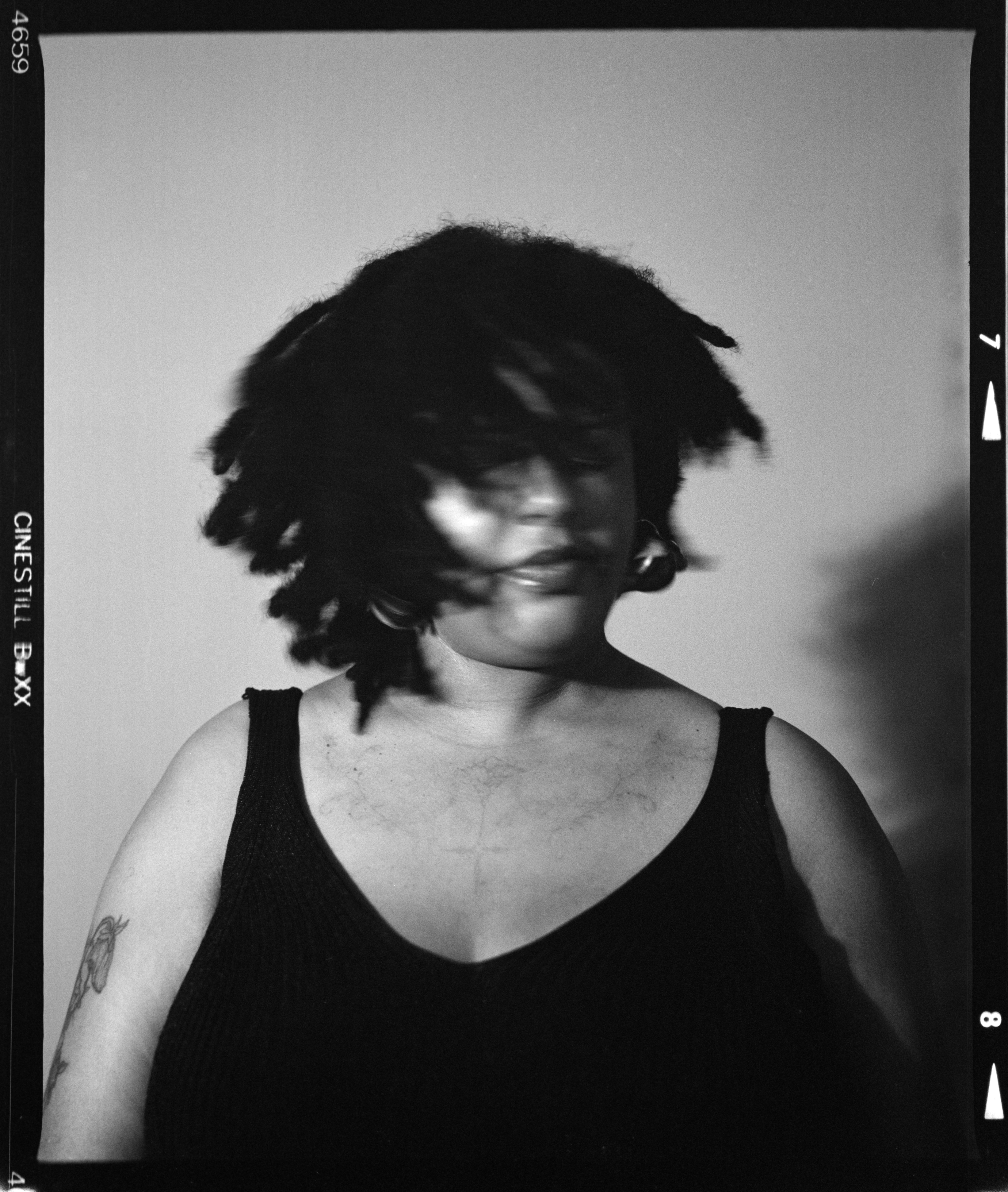 Woman with dreadlocks shaking her head