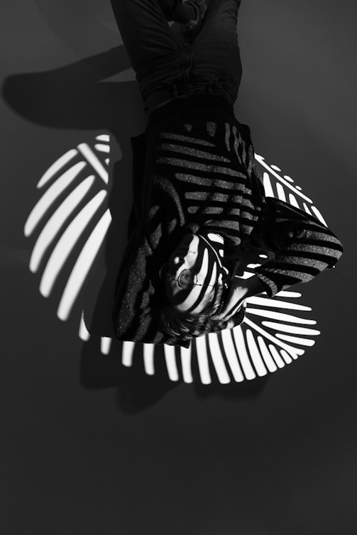 Man with striped shadows across his face